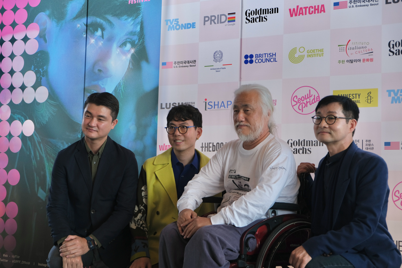 From left: The 2022 Seoul International Pride Film Festival’s programmers Lee Dong-yoon, Kim Seung-hwan, head of the Solidarity Against Disability Discrimination Park Kyung-seok and SIPFF Head of Executive Committee Kim Jho Gwang-soo pose for photos after a press conference held at Artnine Theater in Sadang-dong on Thursday. (SIPFF)