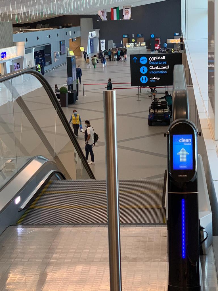 WeClean, an escalator handrail coronavirus sterilization cleaner installed at Kuwait International Airport, 1
