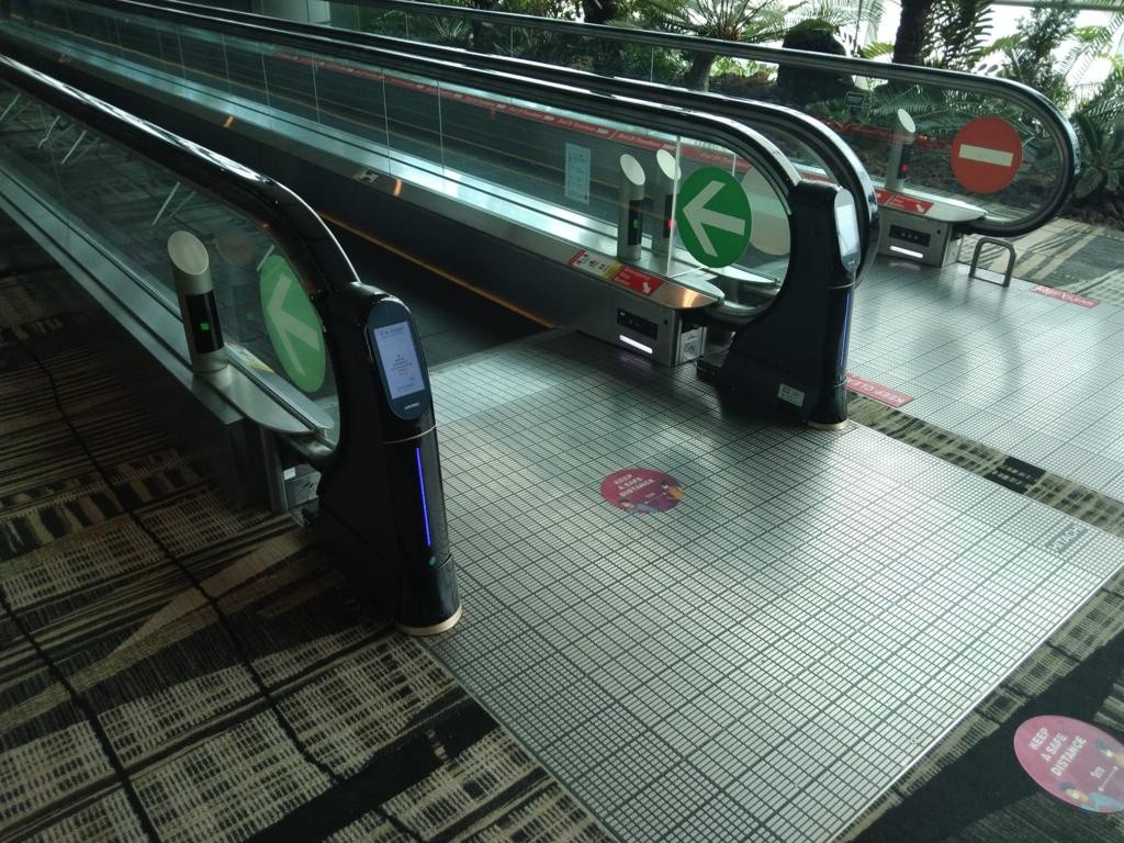WeClean, an escalator handrail coronavirus sterilization cleaner installed at Singapore Changi Airport Terminal 3, 5