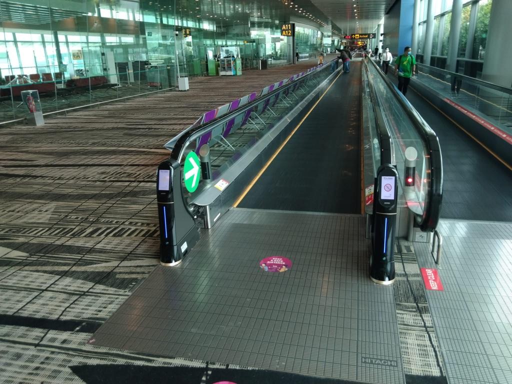 WeClean, an escalator handrail coronavirus sterilization cleaner installed at Singapore Changi Airport Terminal 3, 3