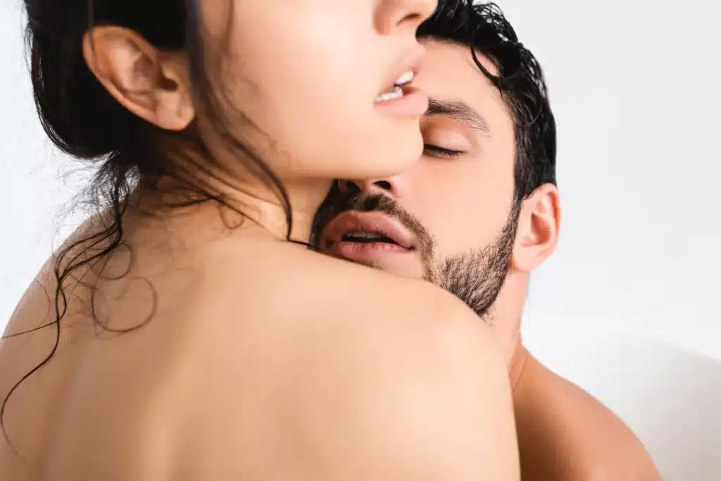handsome man kissing naked girlfriend on white bac 2024 11 07 18 22 59 utc