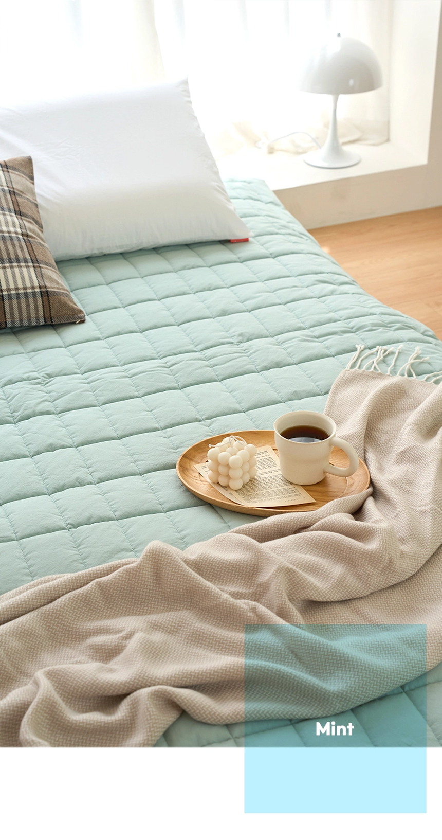 Mint-colored Dr.Friend Sleep Pad styled on a bed with a tray and blanket, highlighting a fresh and relaxing bedroom mood