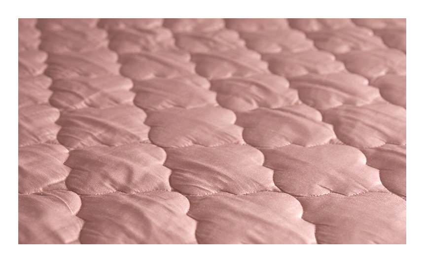 Close-up of the Violet Special Sleep Pad showing detailed quilted stitching and rich violet fabric texture