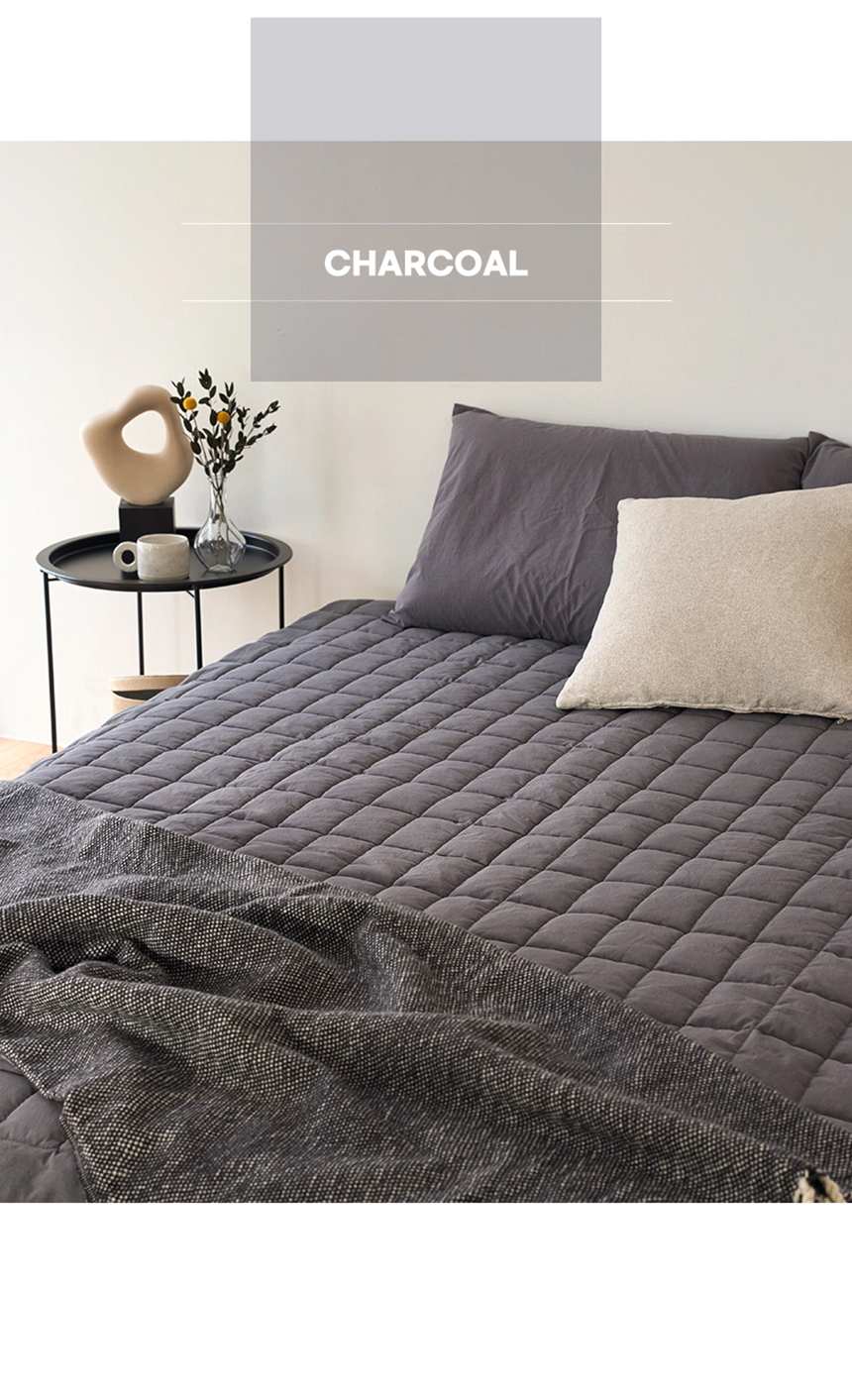 Charcoal-colored Dr.Friend Sleep Pad styled with neutral decor, presenting a calm and refined bedroom atmosphere
