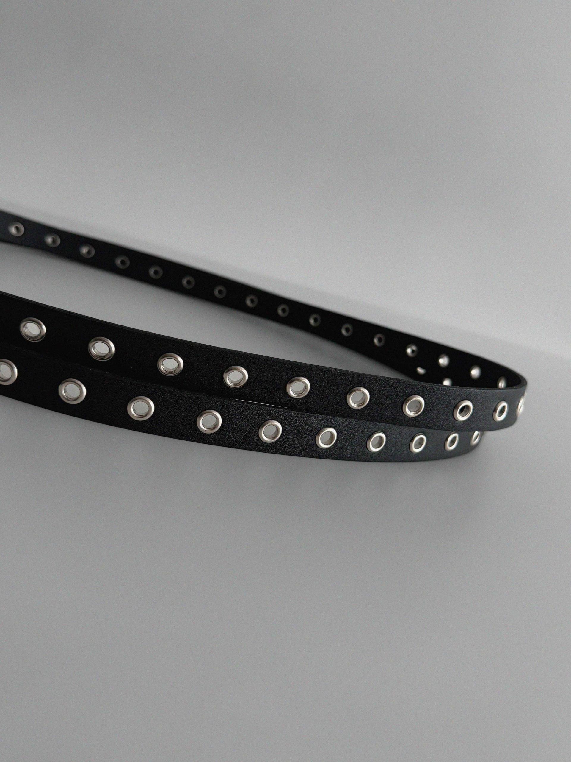 Dual eyelet long belt