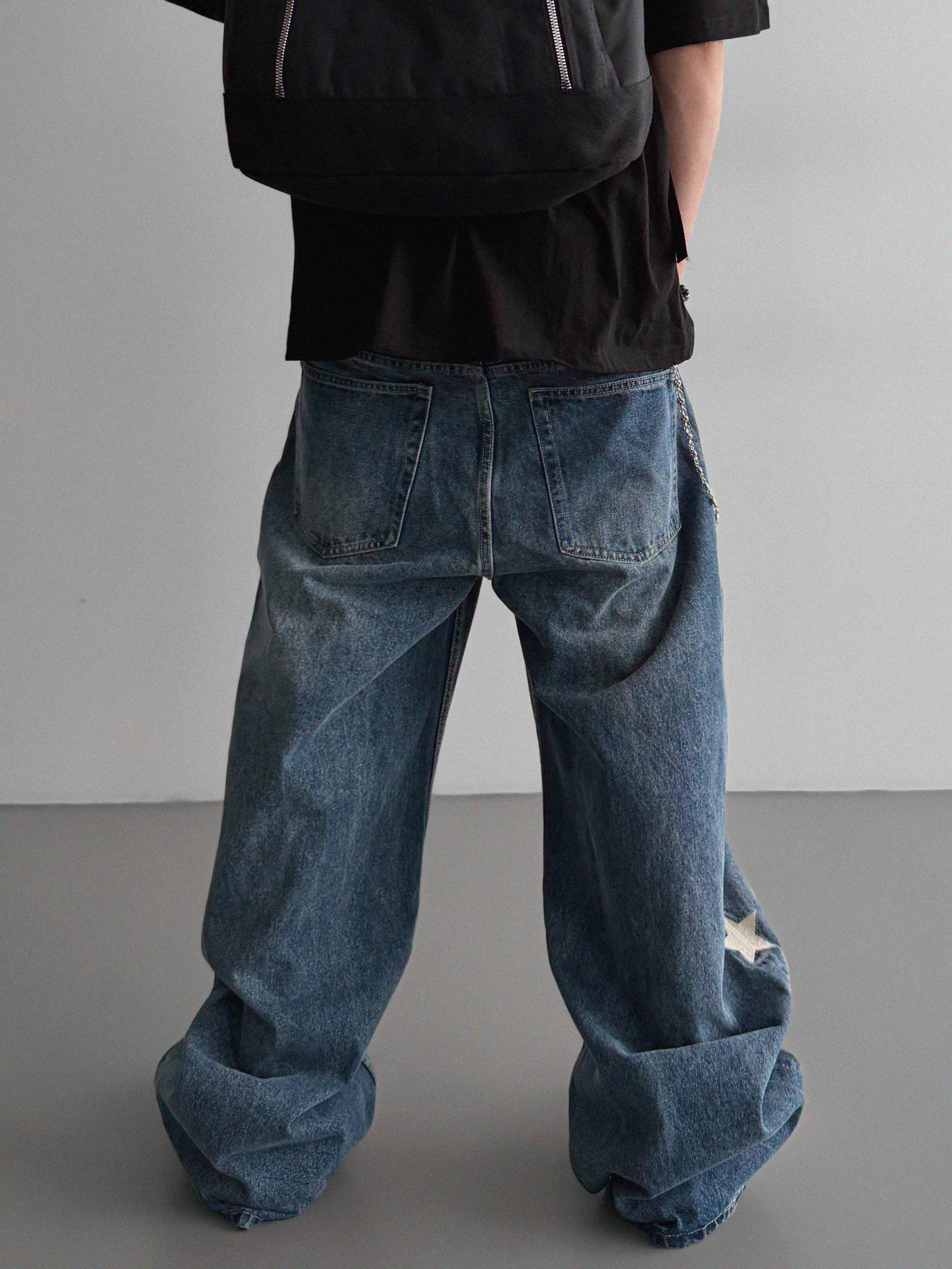 Star embroidered curved denim pants