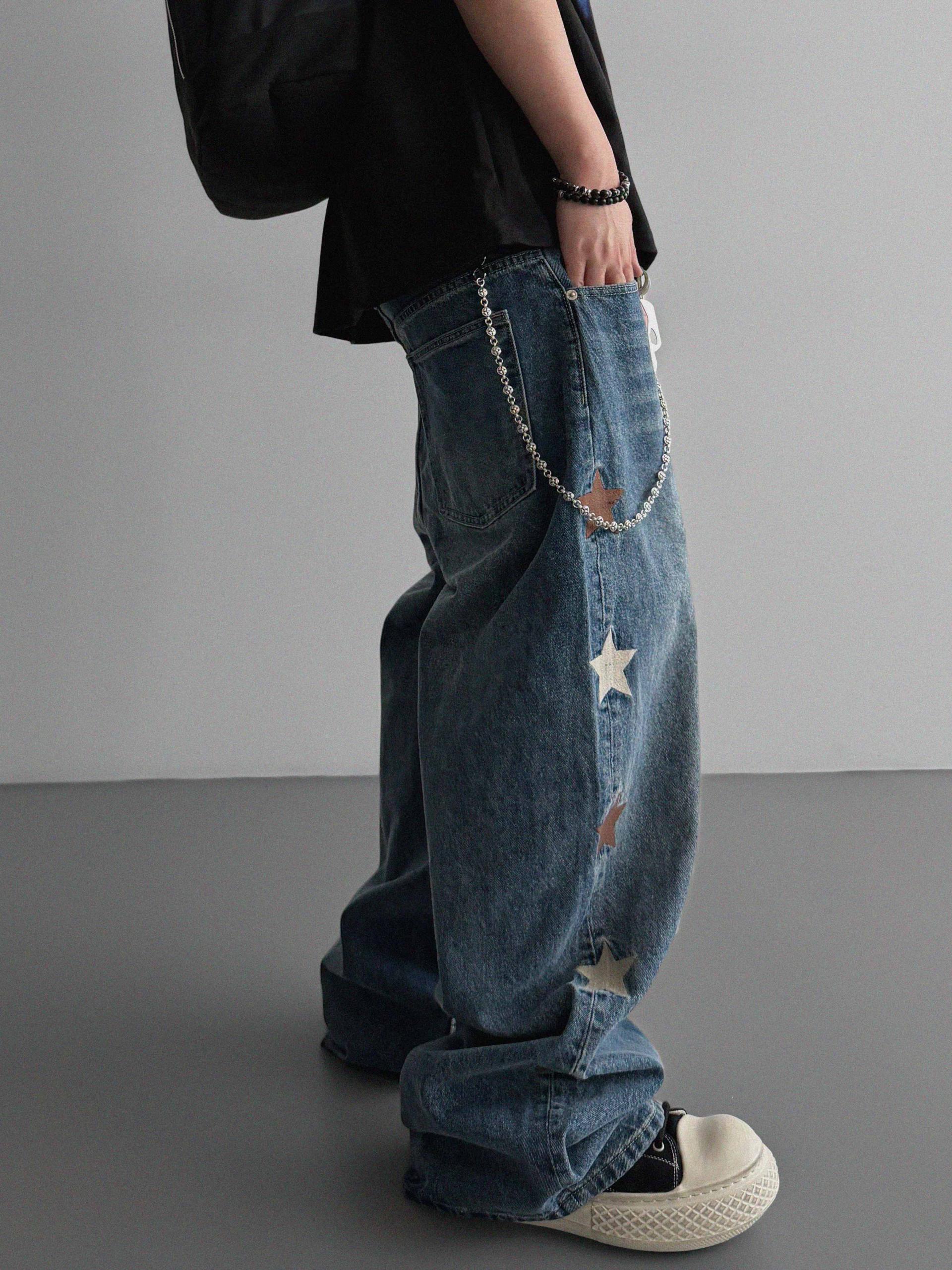 Star embroidered curved denim pants