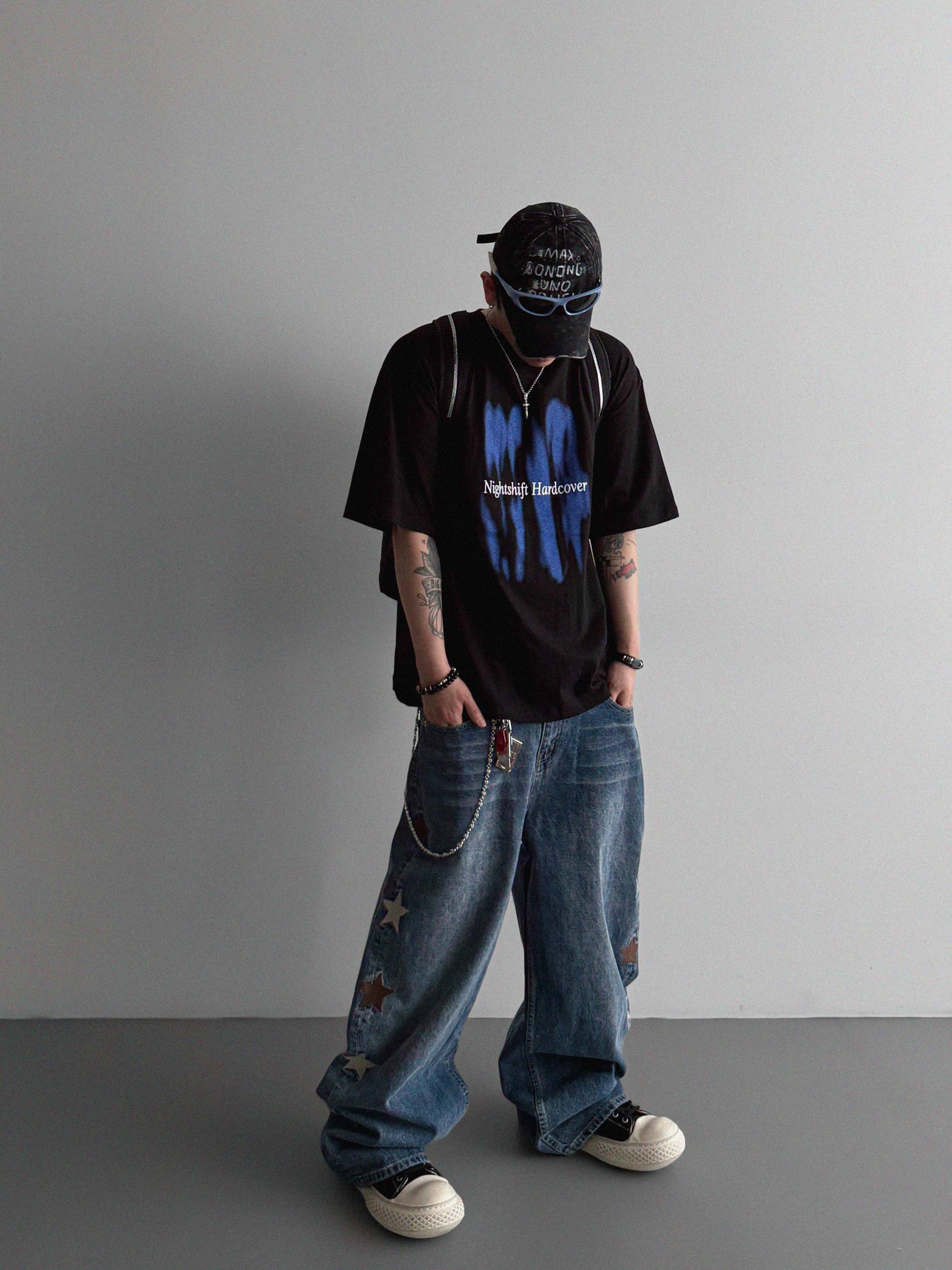 Star embroidered curved denim pants