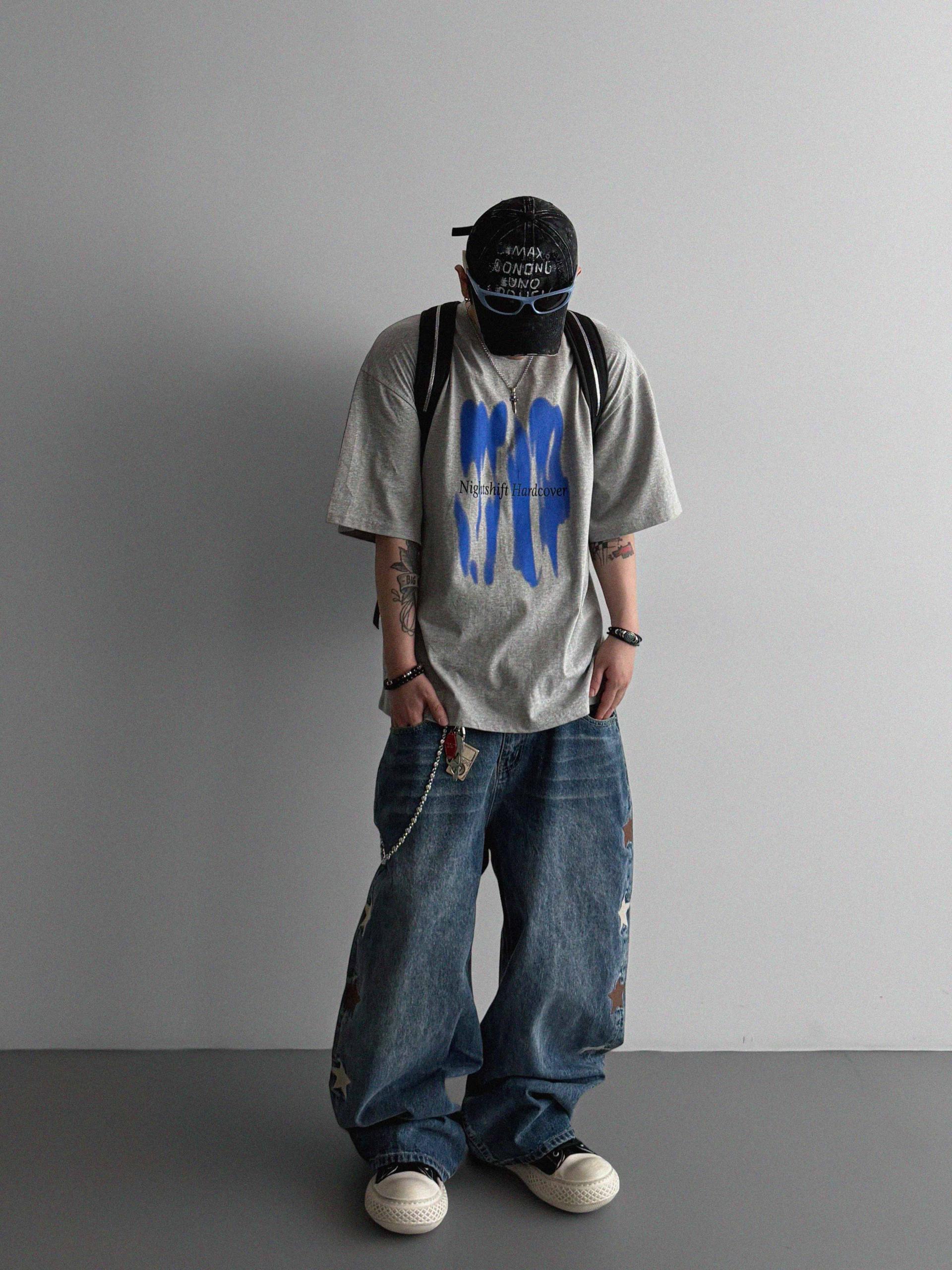 Star embroidered curved denim pants