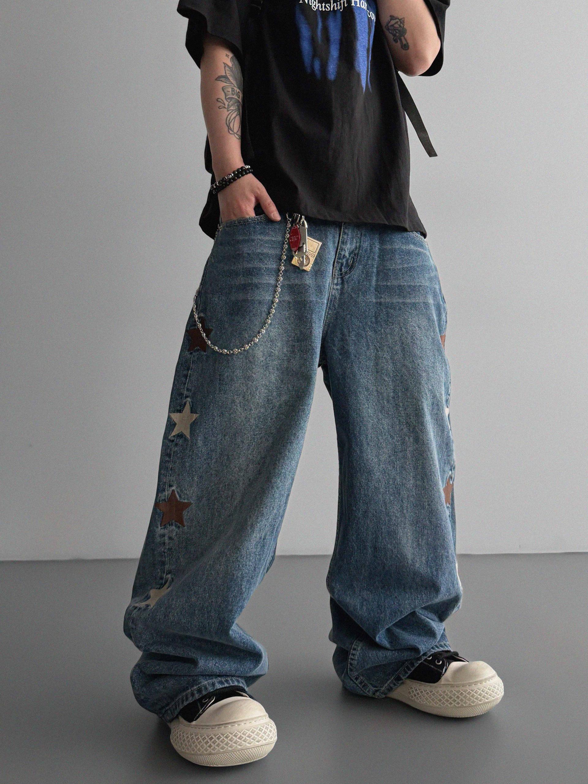 Star embroidered curved denim pants