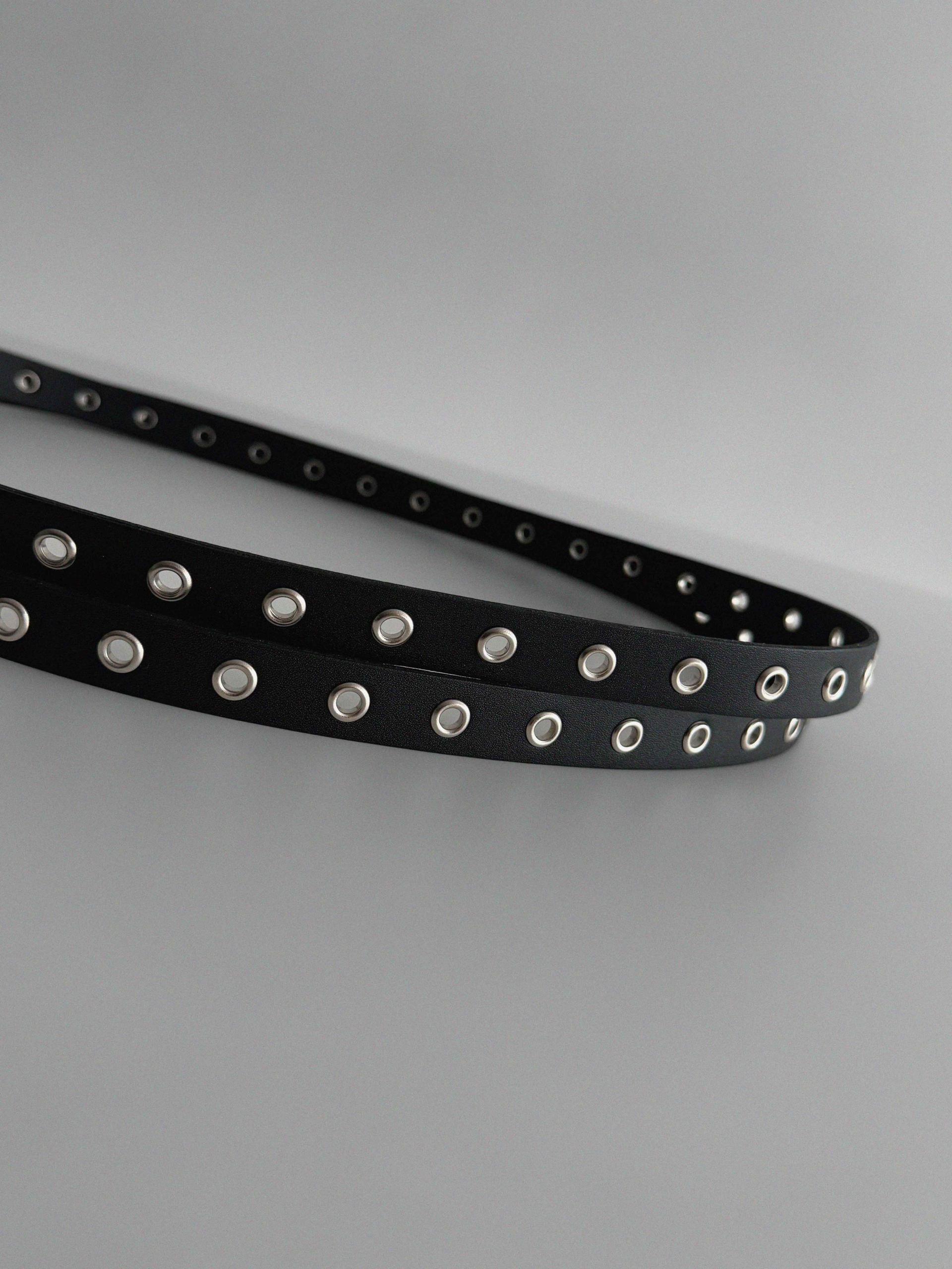 Dual eyelet long belt