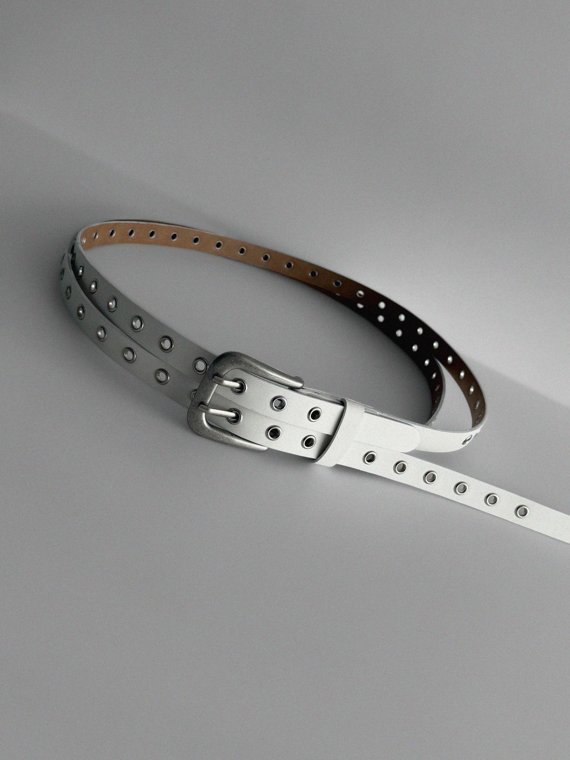 Dual eyelet long belt