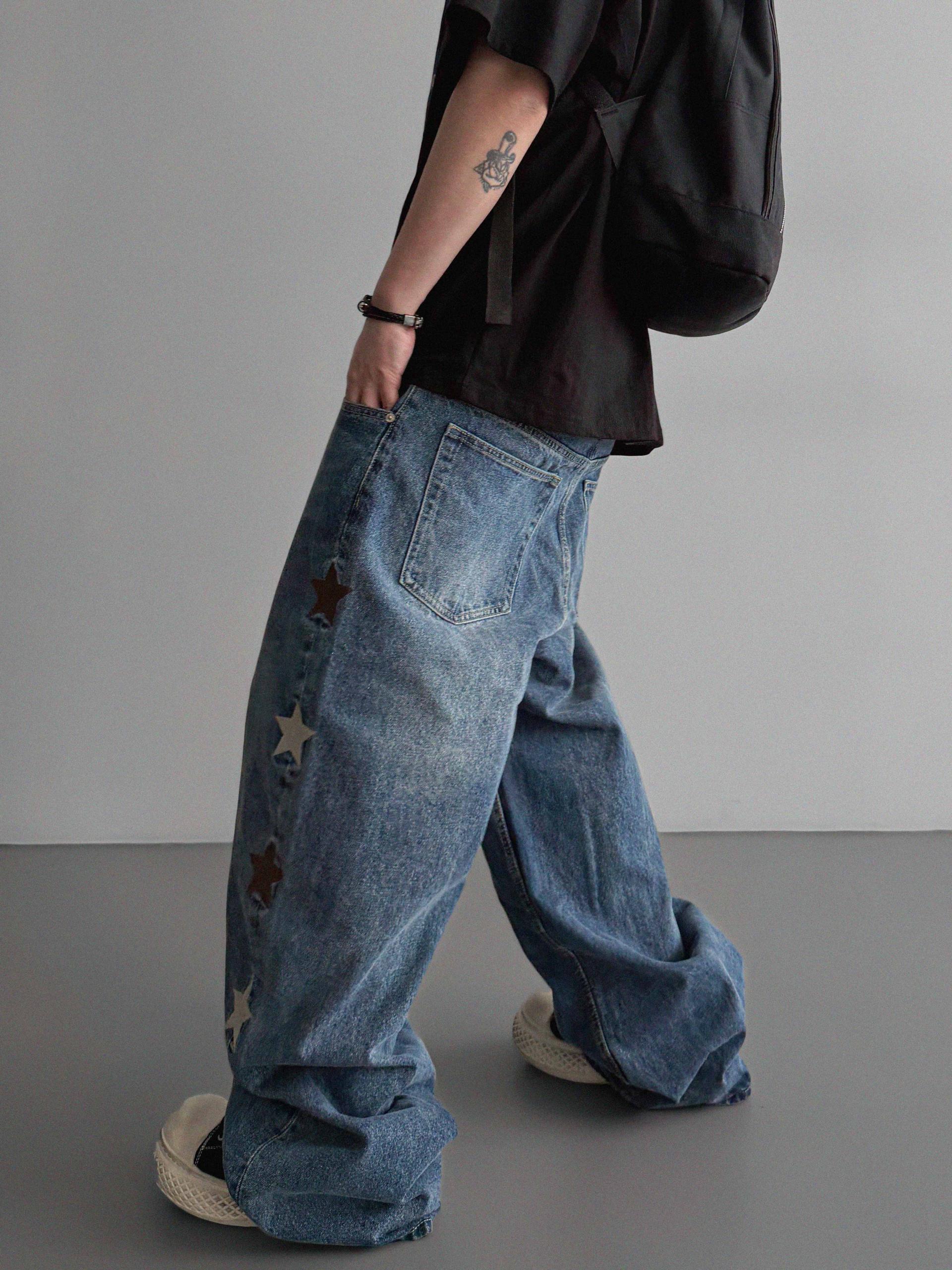 Star embroidered curved denim pants