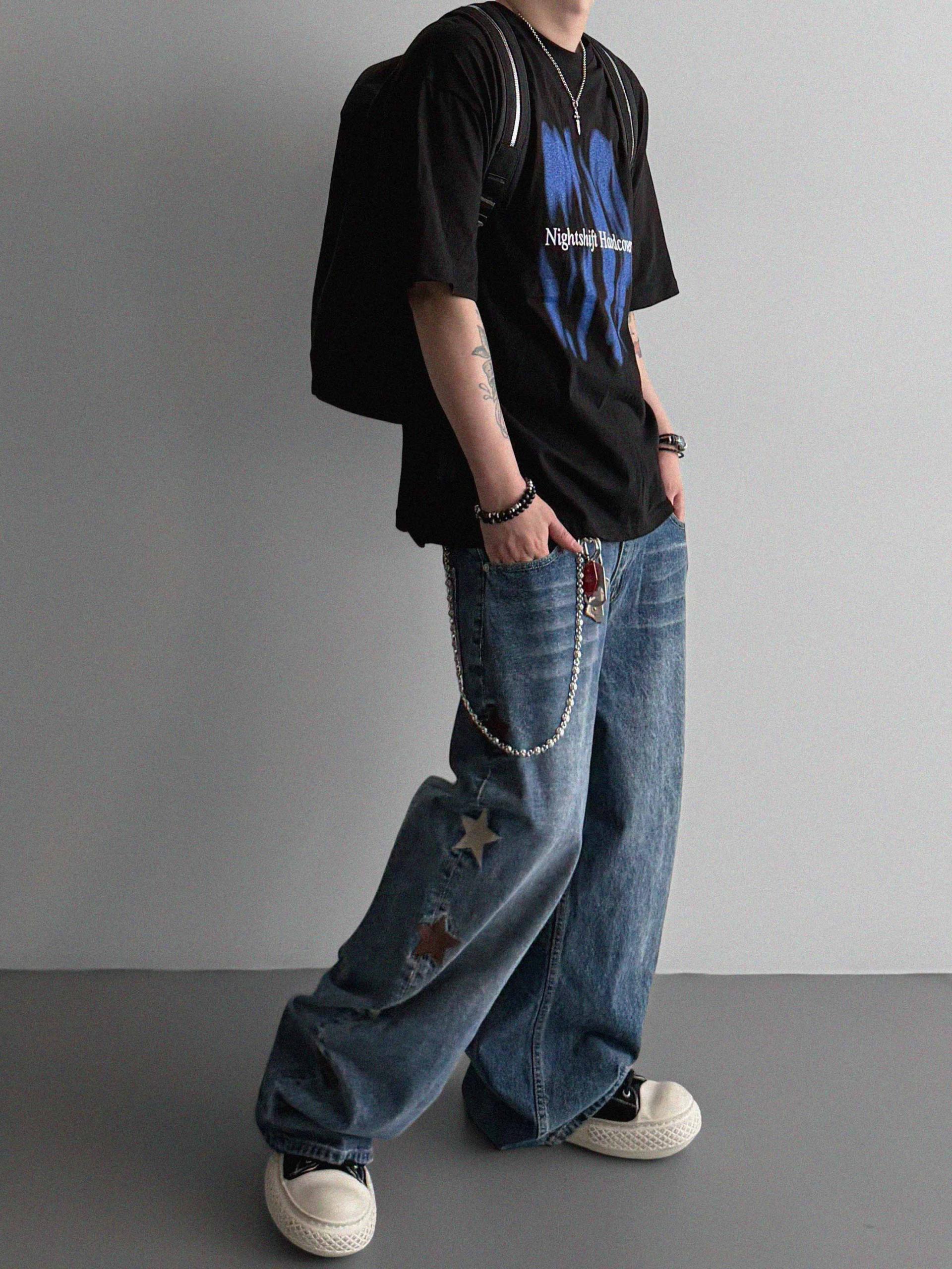 Star embroidered curved denim pants