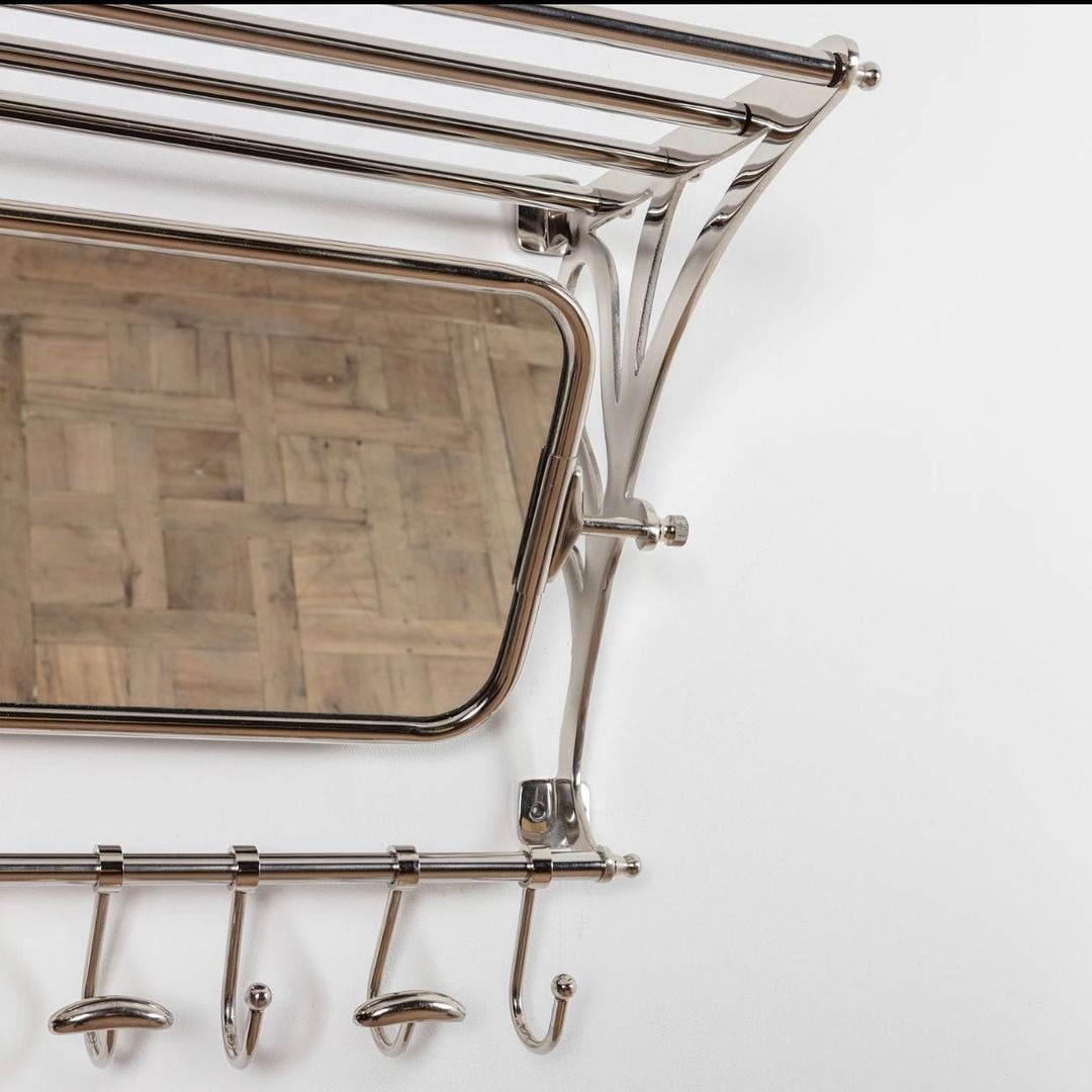 Train wall rack with mirror