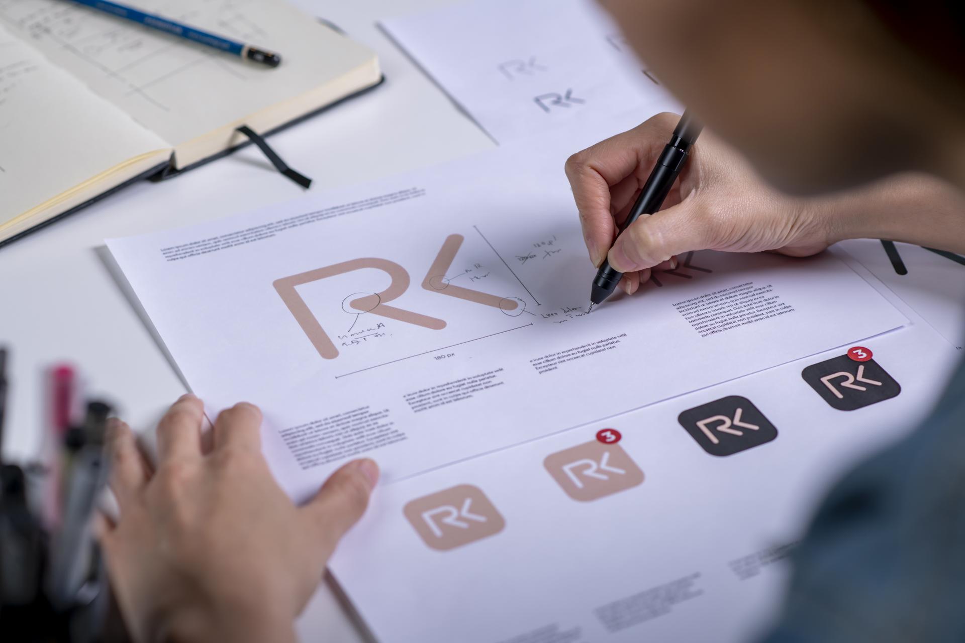 graphic-designer-drawing-sketches-logo-design-concept-new-brand-professional-creative-occupation-with-idea.jpg
