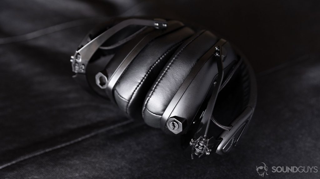 A picture of the V-Moda M-100 Master headphones with the ear cups folded toward the headband, focusing on the dual-3.5mm inputs.
