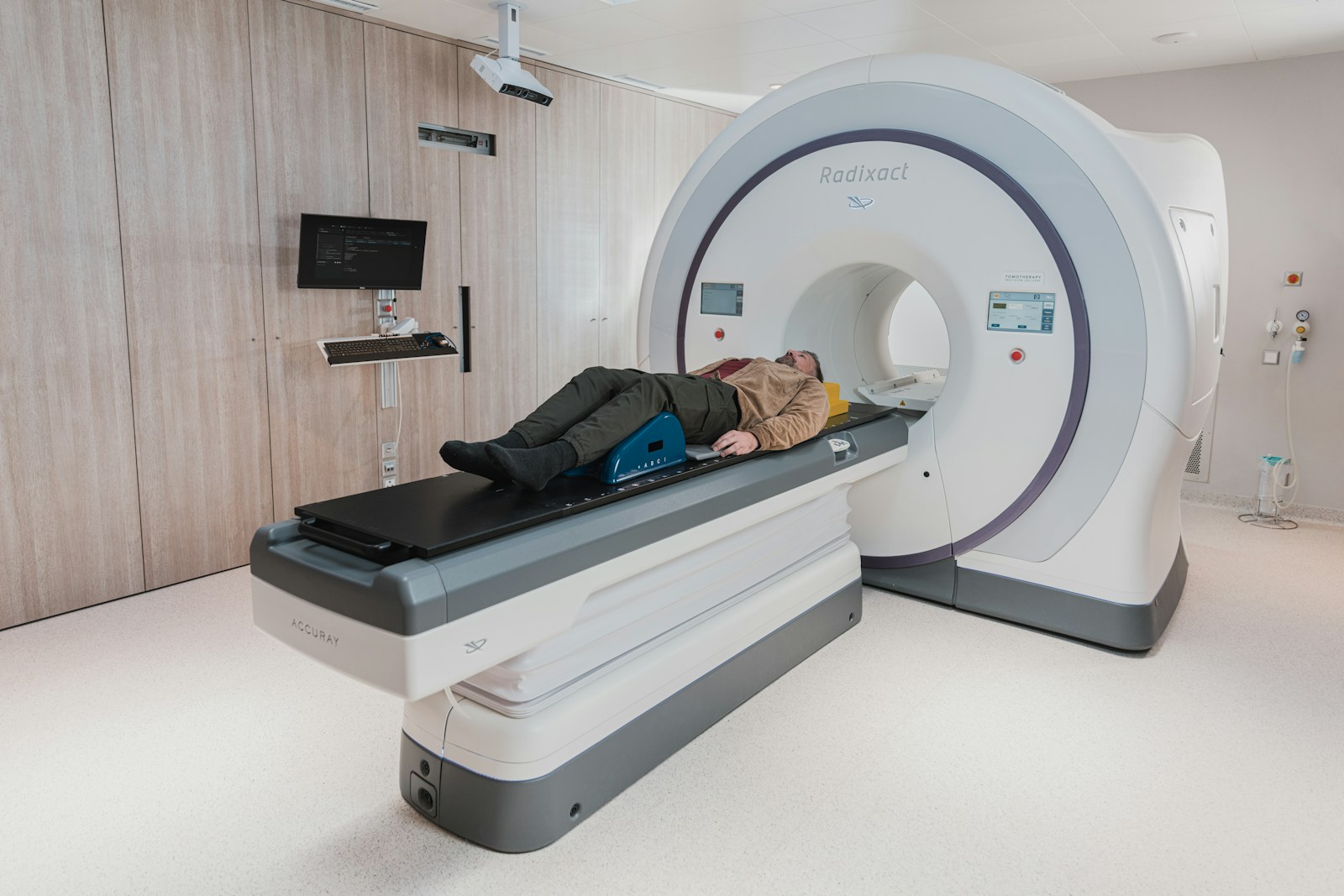 Patient lying in CT scanner — medical imaging