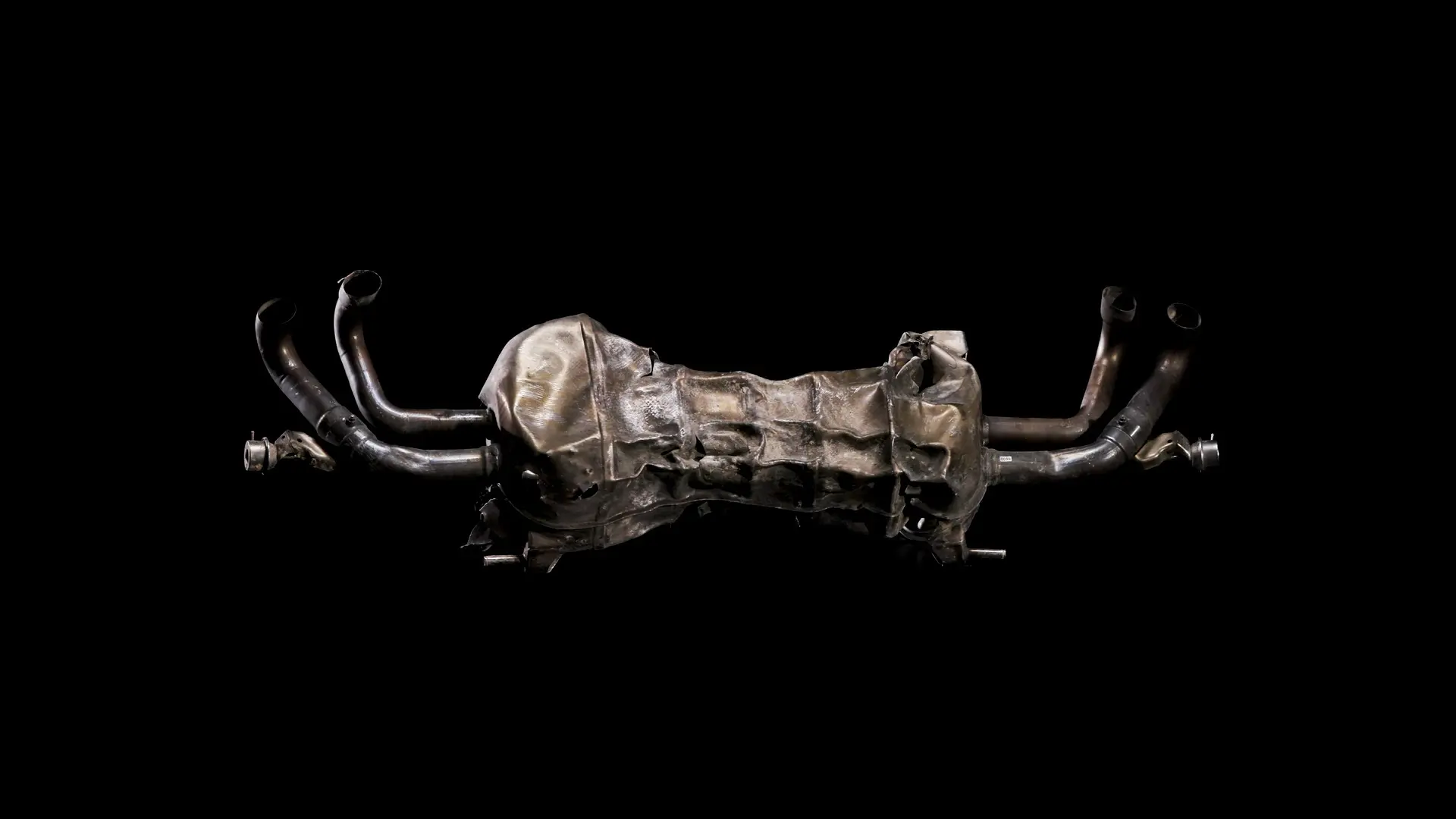 SHL0MS, CAR // 0009, 2022. I Still from rotating video of an exhaust muffler from a detonated Lamborghini Huracan.