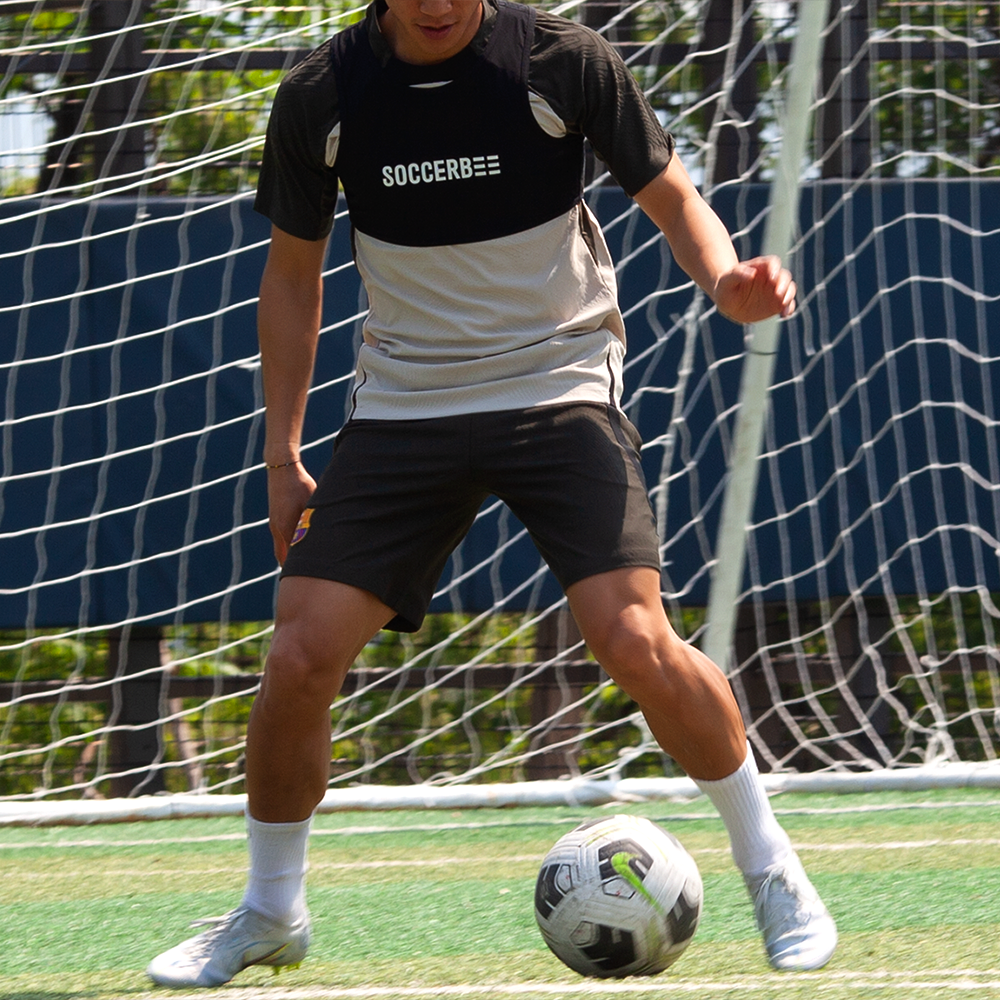 A player wearing the SOCCERBEE vest while playing football