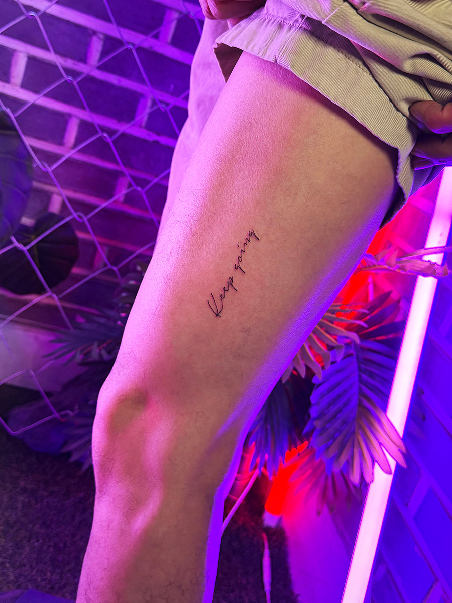 Calligraphy tattoo detail and fine lines