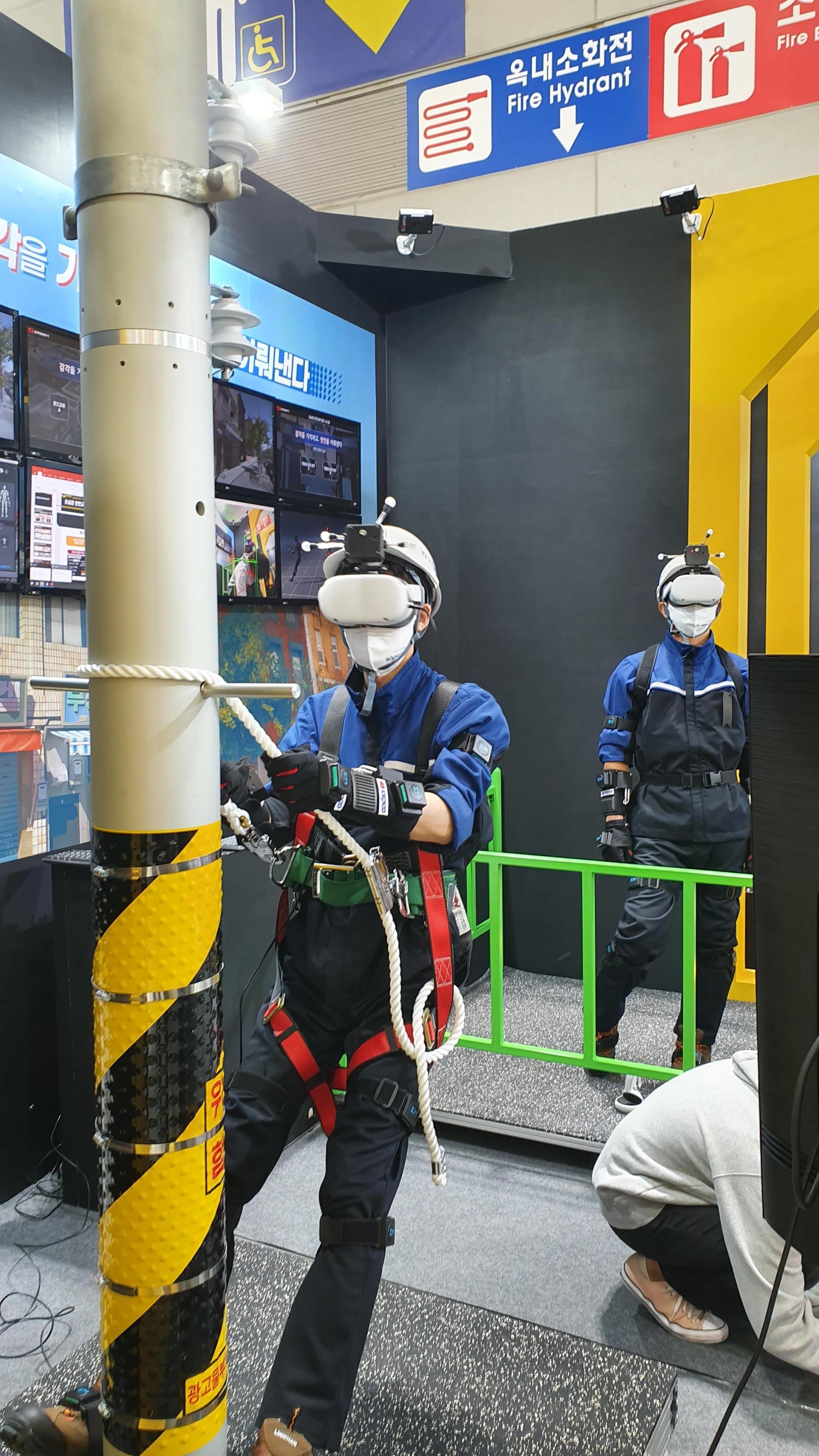 VR electrical safety training using a utility-pole simulator and safety harness