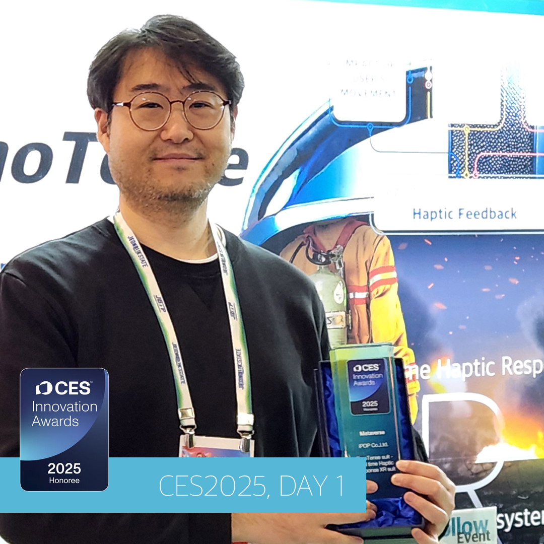 iPOP representative holding a CES 2025 Innovation Awards plaque for the EmoTense Suit