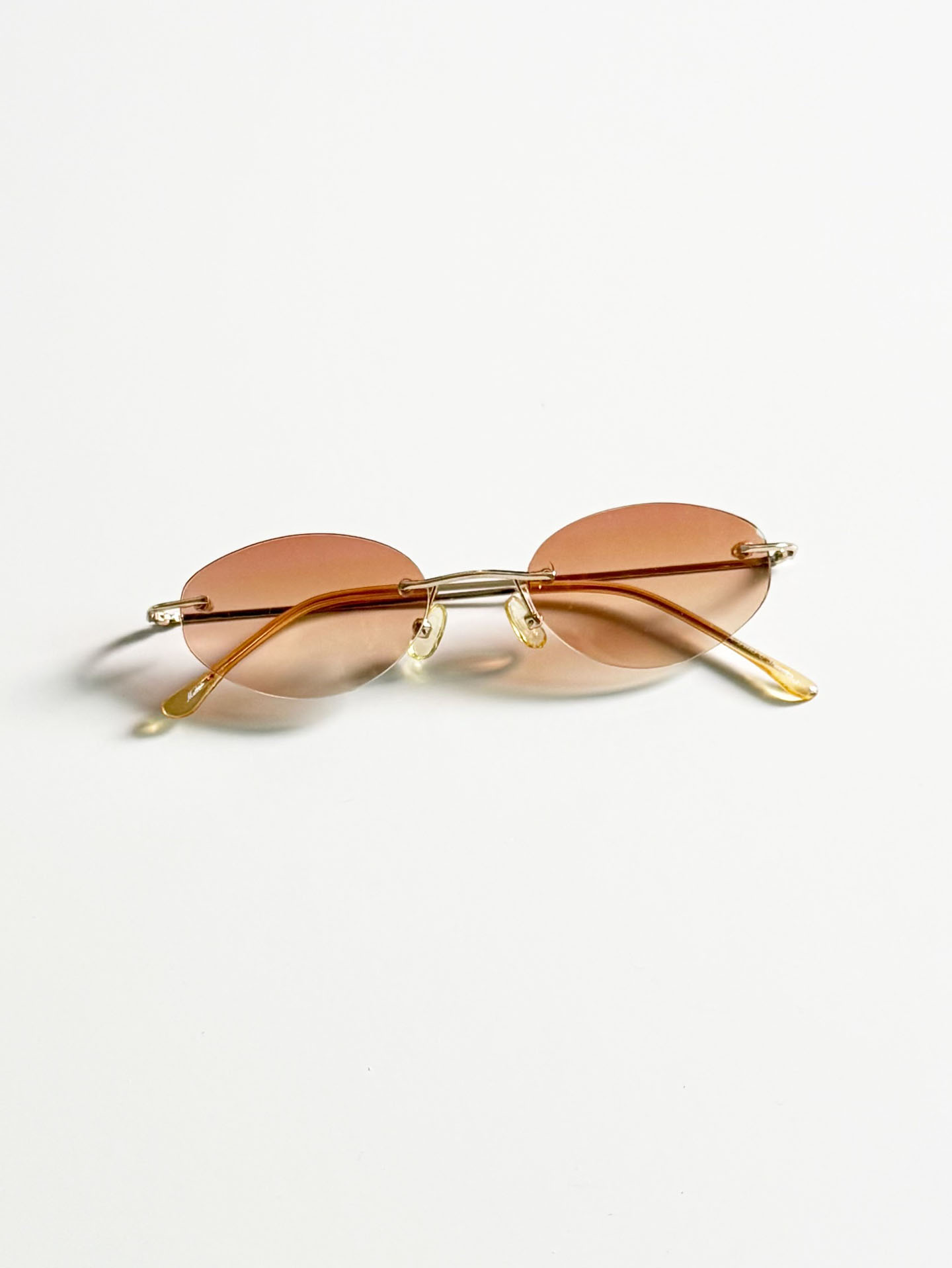CAPRIO Rimless Oval Gold Metal Tinted Sunglasses