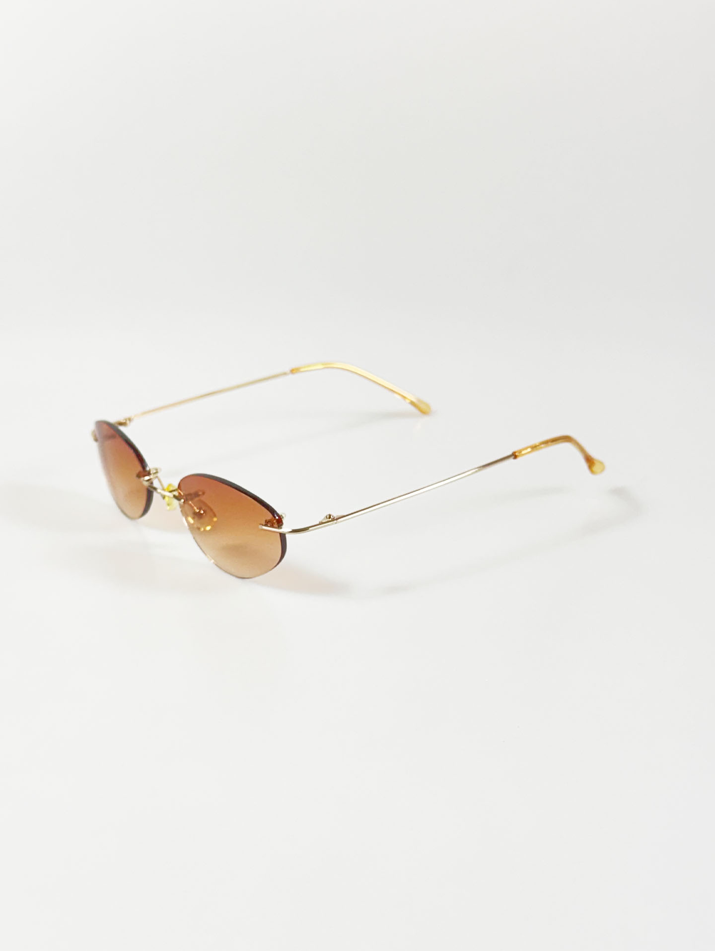 CAPRIO Rimless Oval Gold Metal Tinted Sunglasses