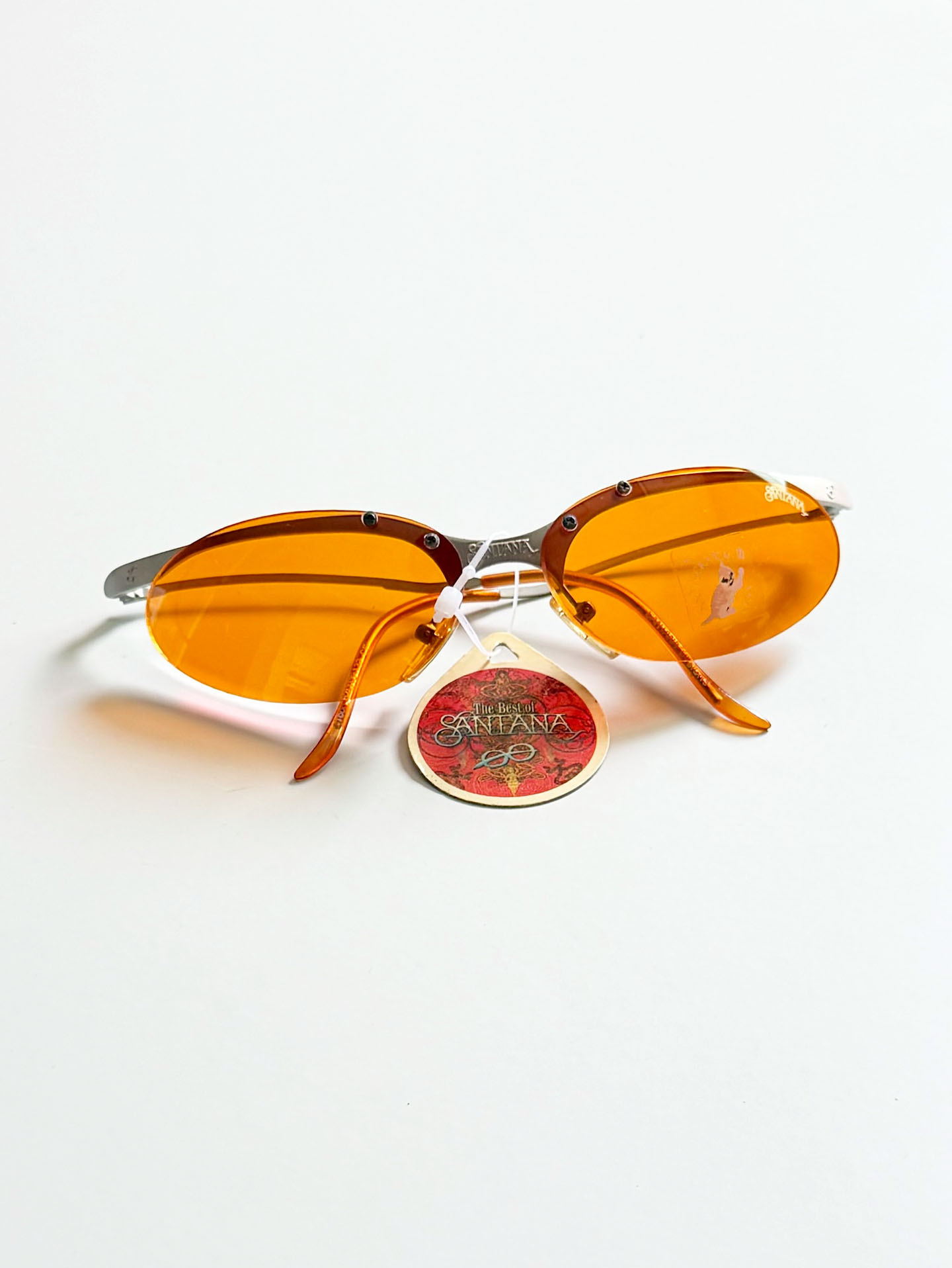90's SANTANA Silver Rimless Oval Metal Orange Tint Sunglasses
