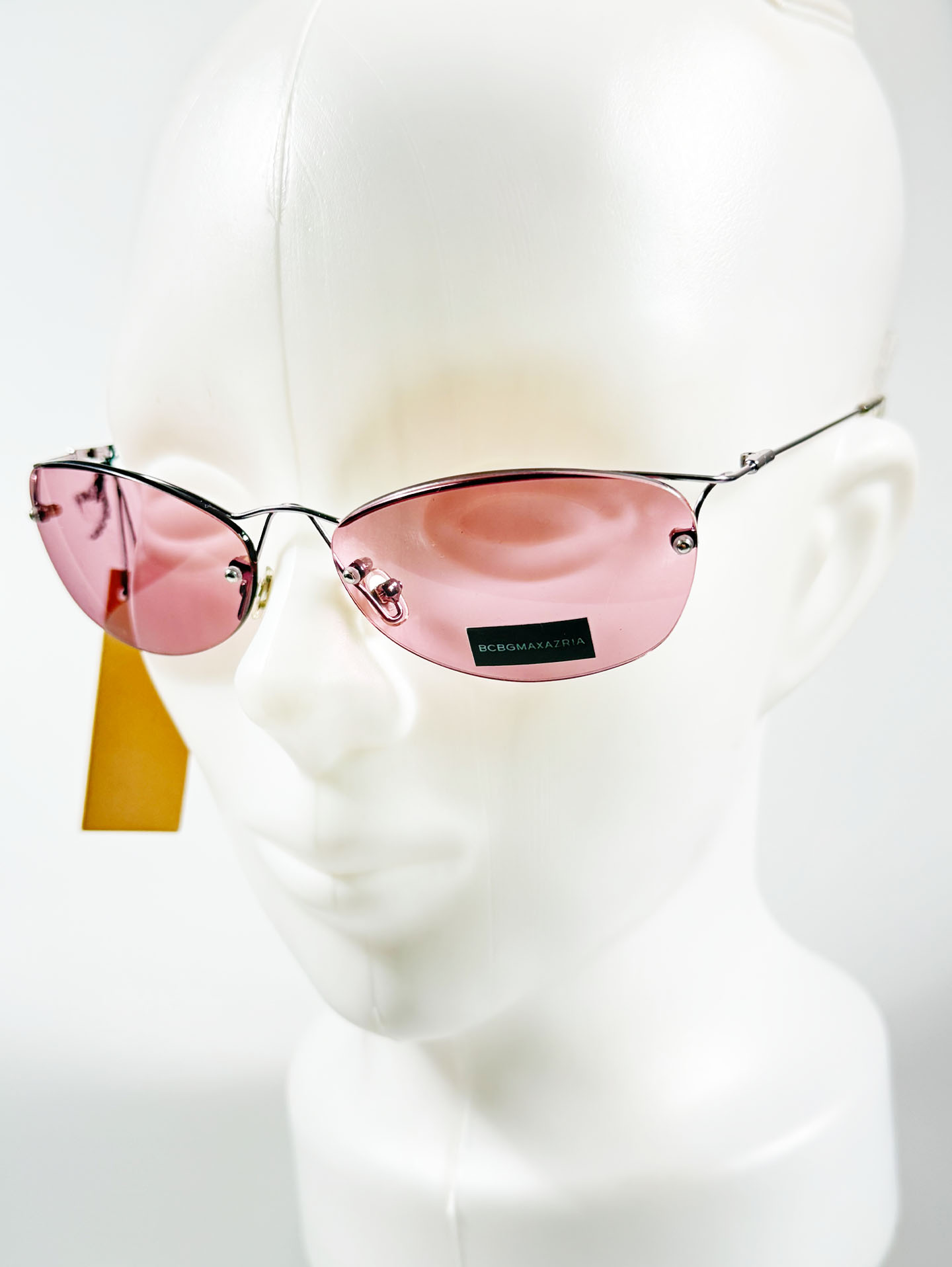 BCBGMAXAZRIA Slim Oval Rimless Metal Tint Sunglasses
