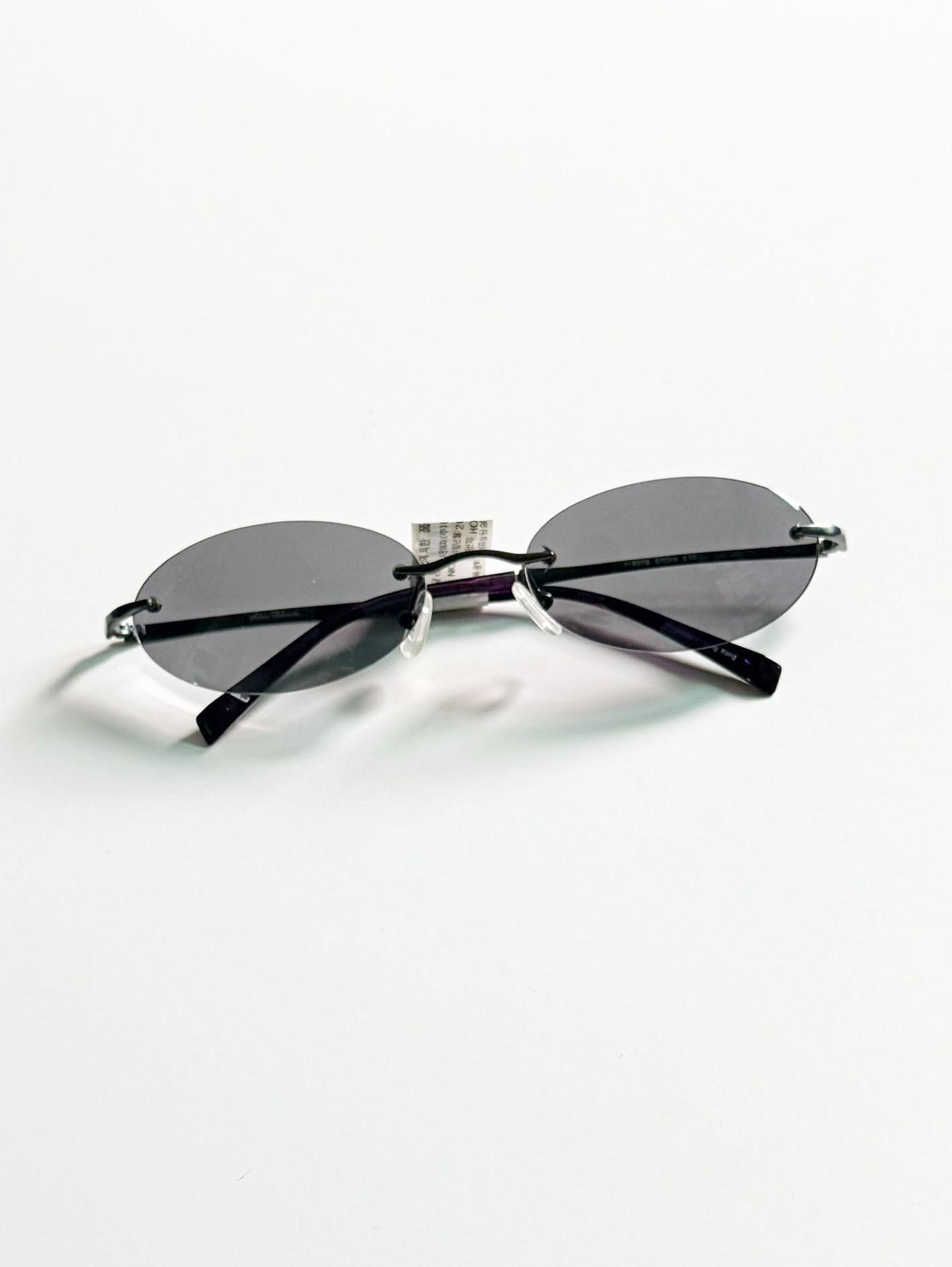 SILVIO VALENCIA Smoke Oval Rimless Metal Sunglasses