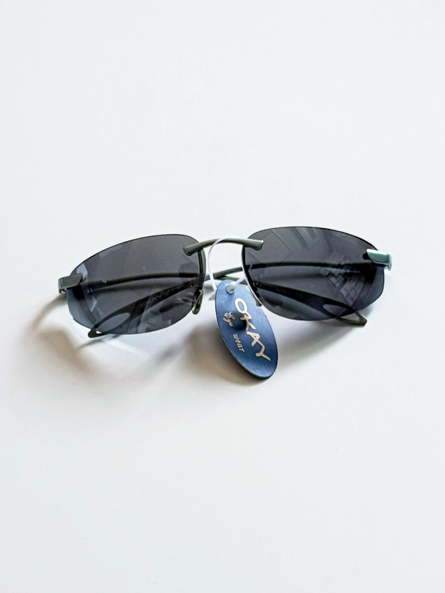 90s OKAY EYEWEAR Rimless Wraparound Blue Gray Metal Sunglasses