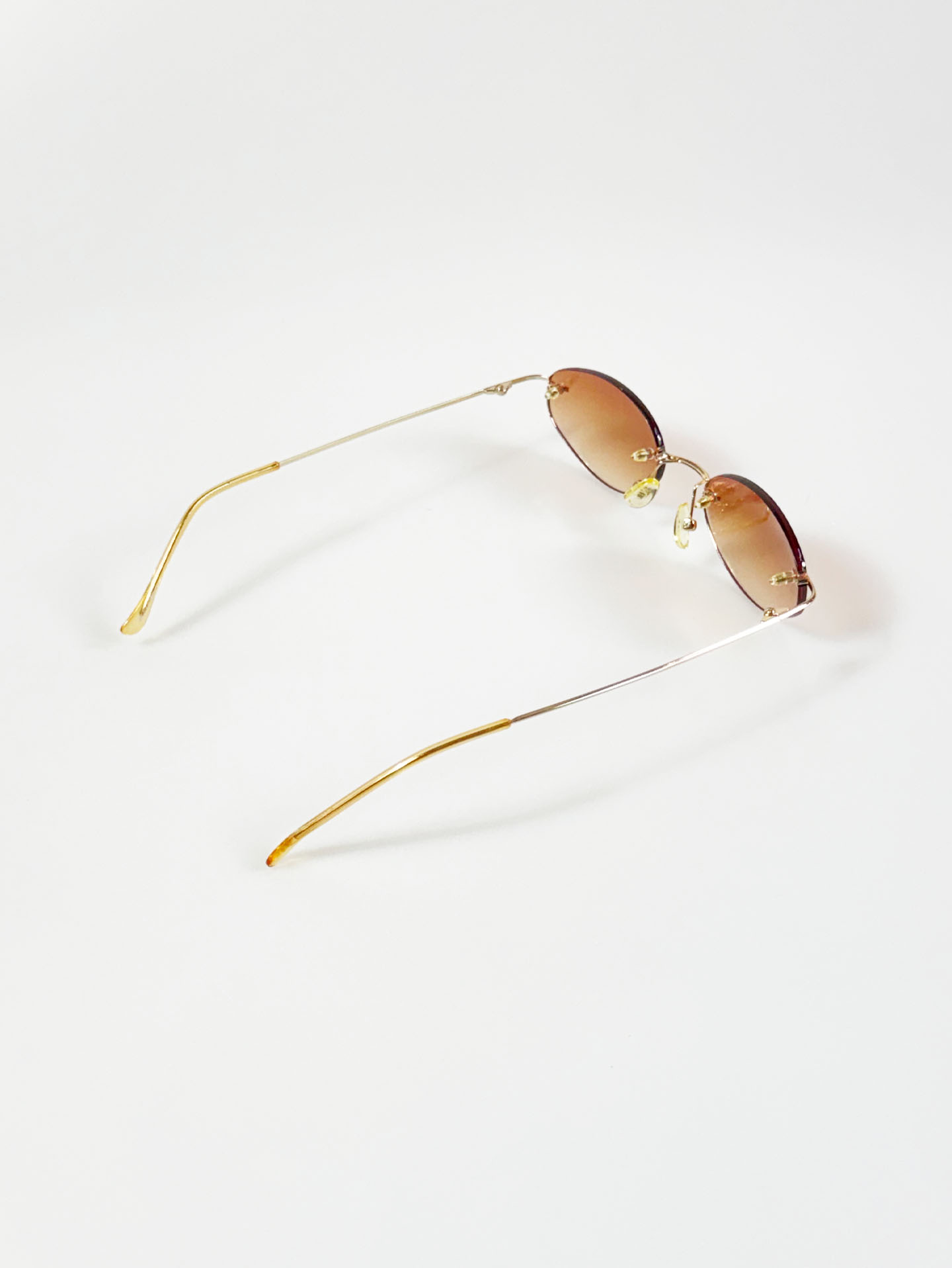 CAPRIO Rimless Oval Gold Metal Tinted Sunglasses