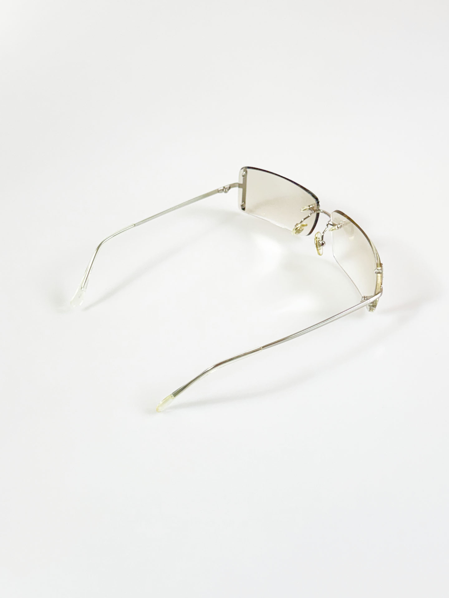 CAPRIO Silver Rimless Square Metal Clear Tinted Sunglasses