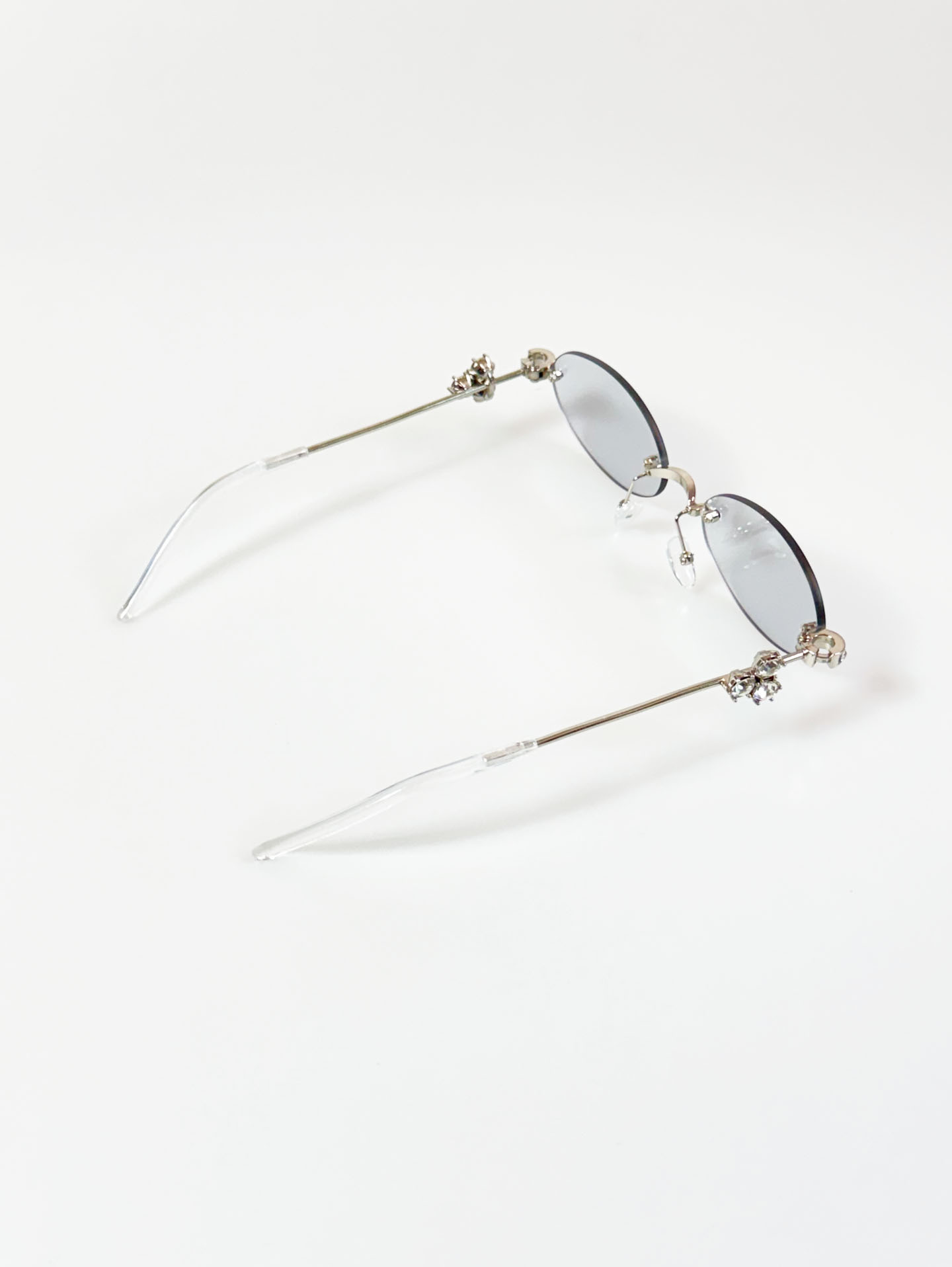 Crystal Detail Rimless Oval Silver Metal Frame Sunglasses