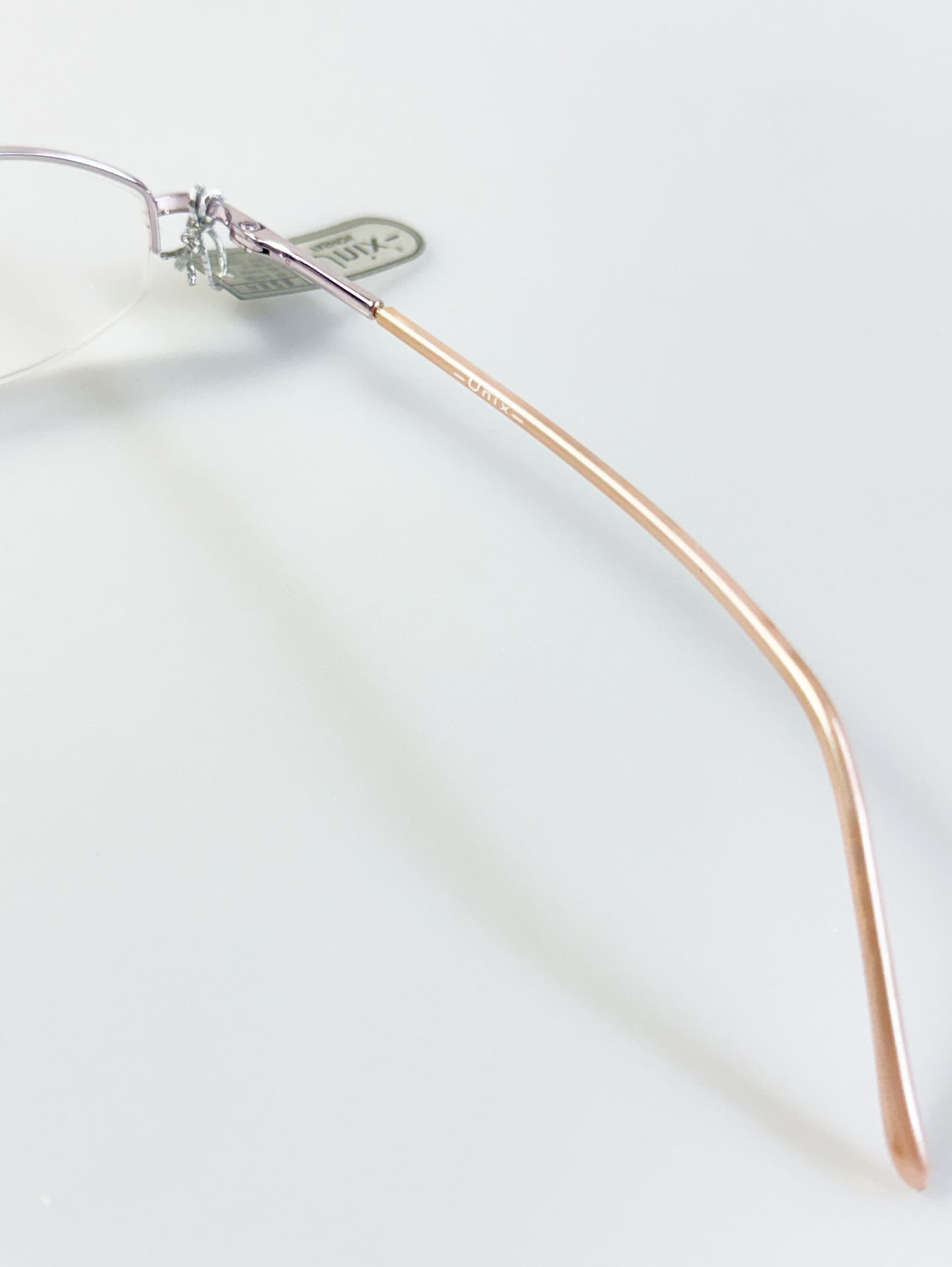 UNIX Light Pink Half-Rim Oval Metal Glasses