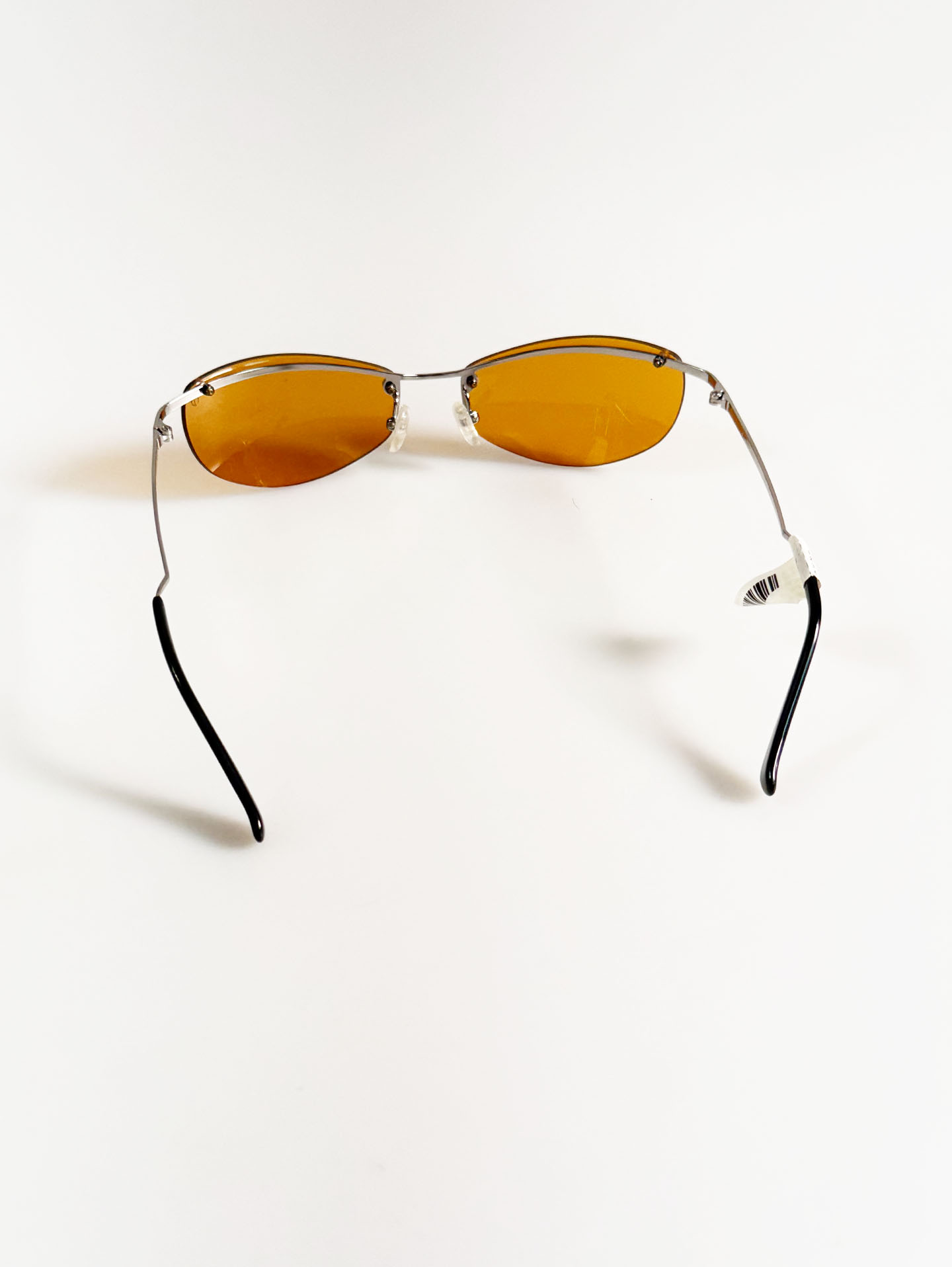 SILVIO VALENCIA Silver Rimless Oval Metal Orange Tint Sunglasses
