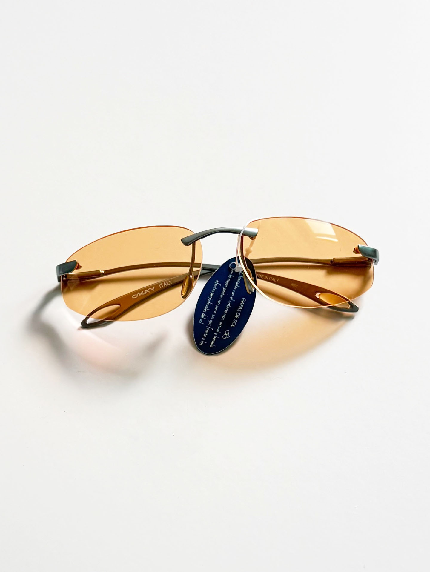 90's OKAY EYEWEAR Orange Tint Oval Rimless Metal Sunglasses