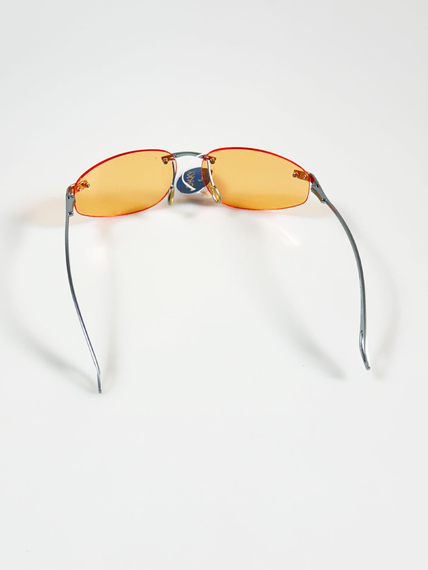 90's OKAY EYEWEAR Orange Tint Oval Rimless Metal Sunglasses