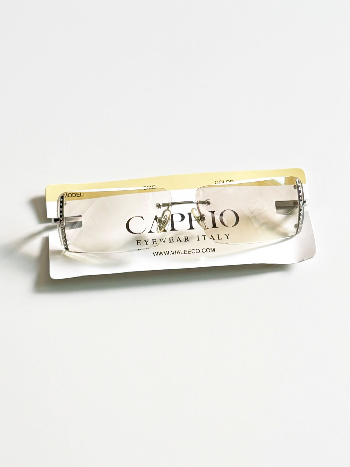 CAPRIO Silver Rimless Square Metal Clear Tinted Sunglasses