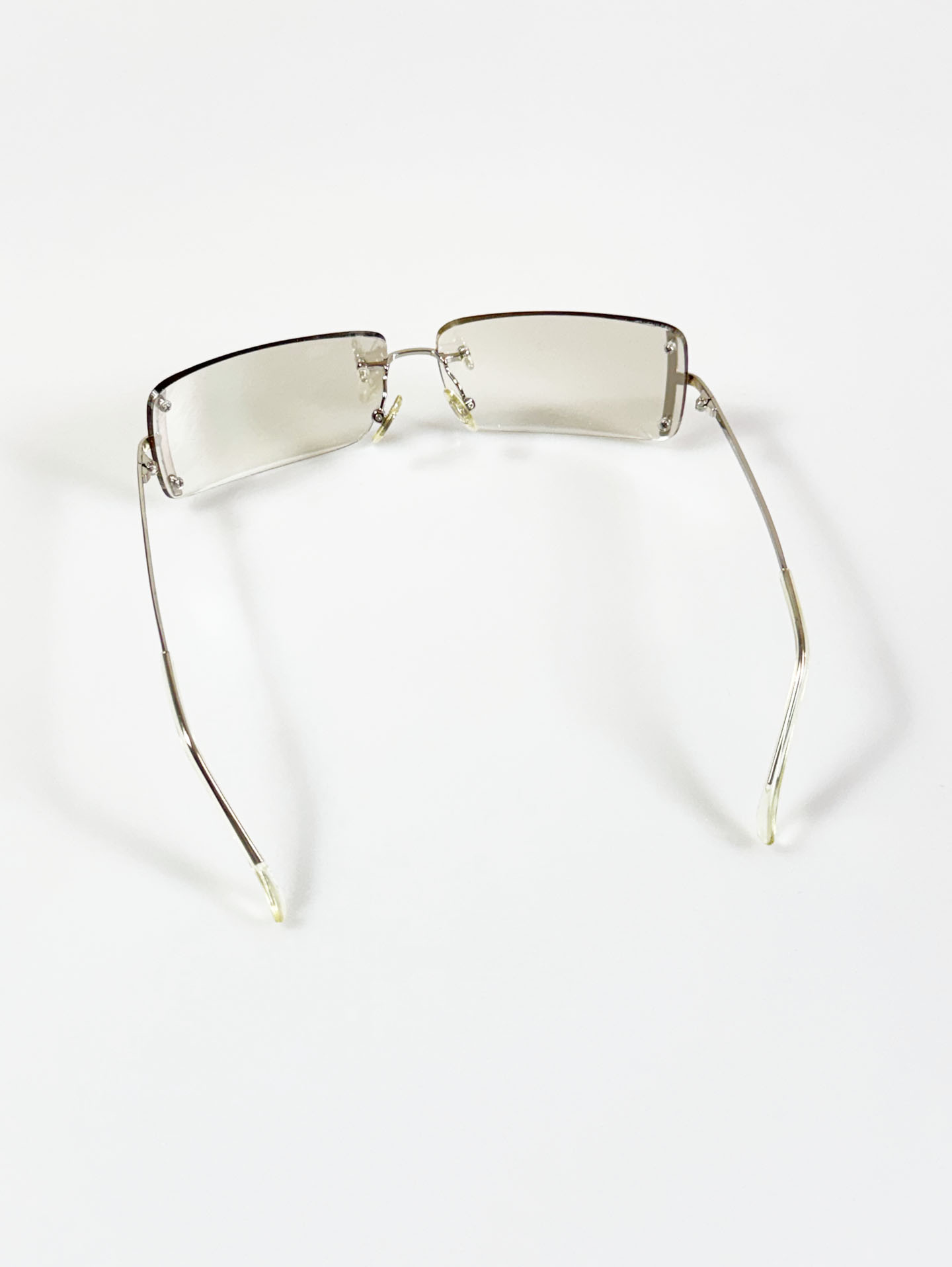CAPRIO Silver Rimless Square Metal Clear Tinted Sunglasses