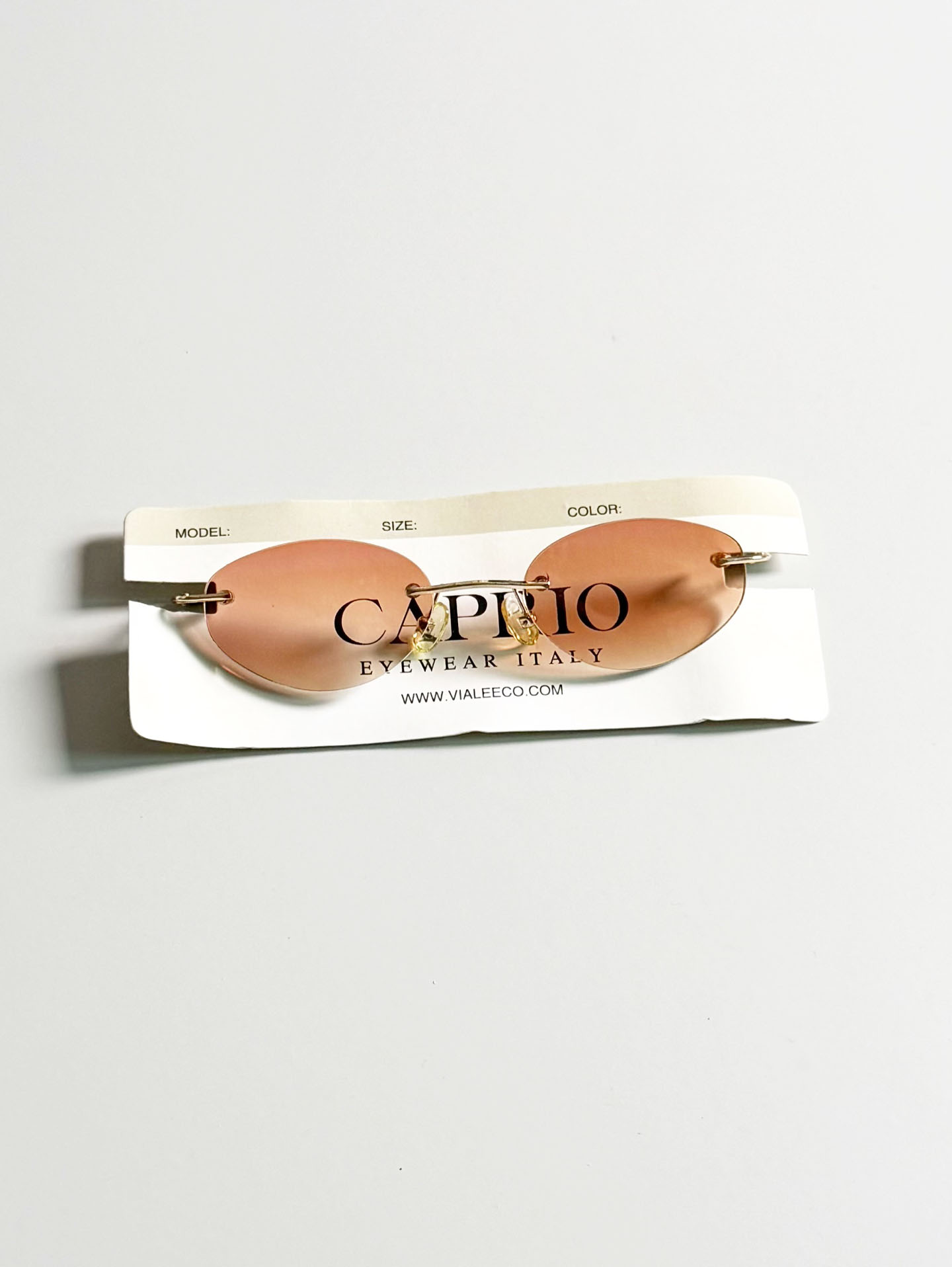CAPRIO Rimless Oval Gold Metal Tinted Sunglasses