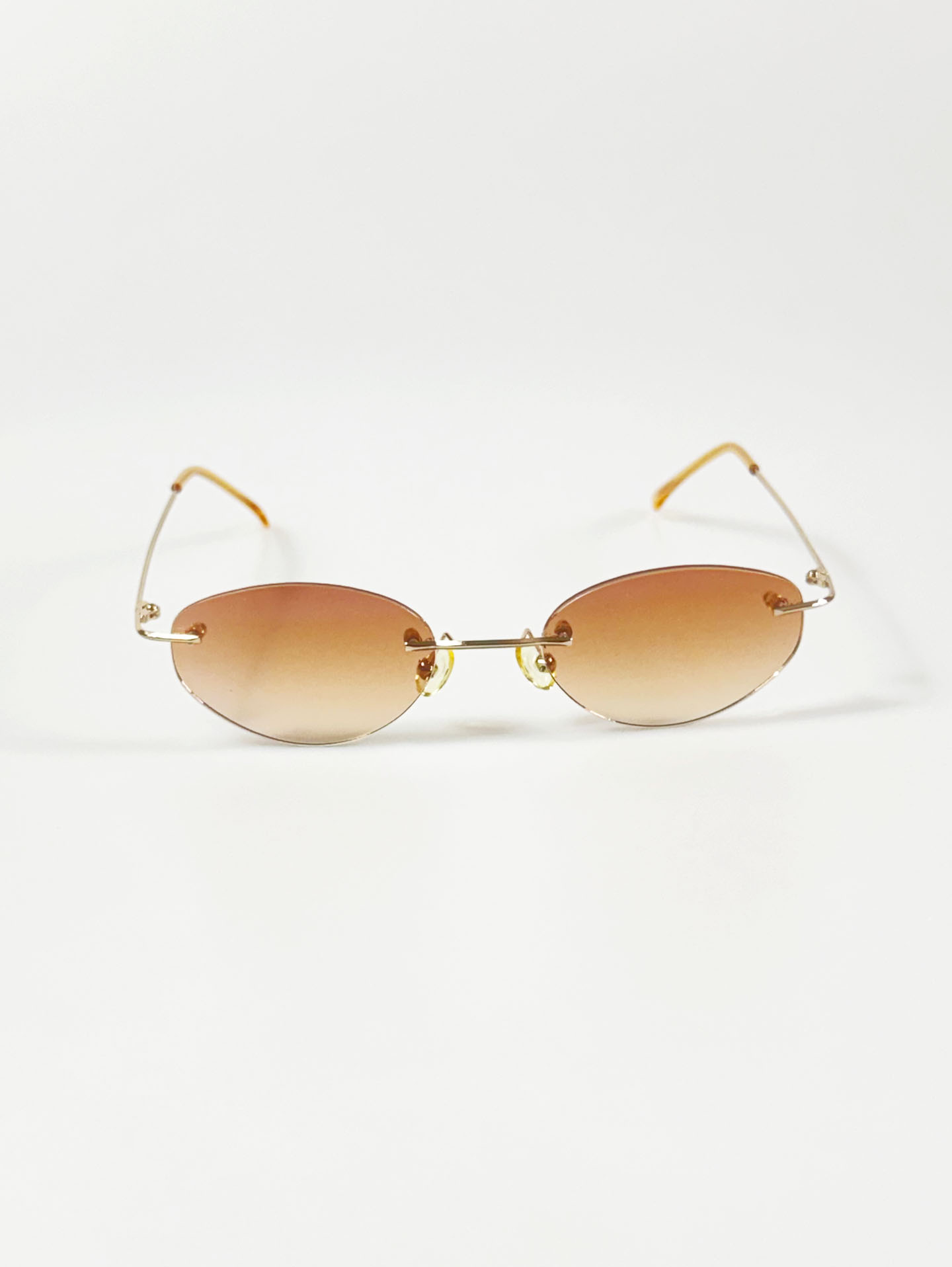 CAPRIO Rimless Oval Gold Metal Tinted Sunglasses