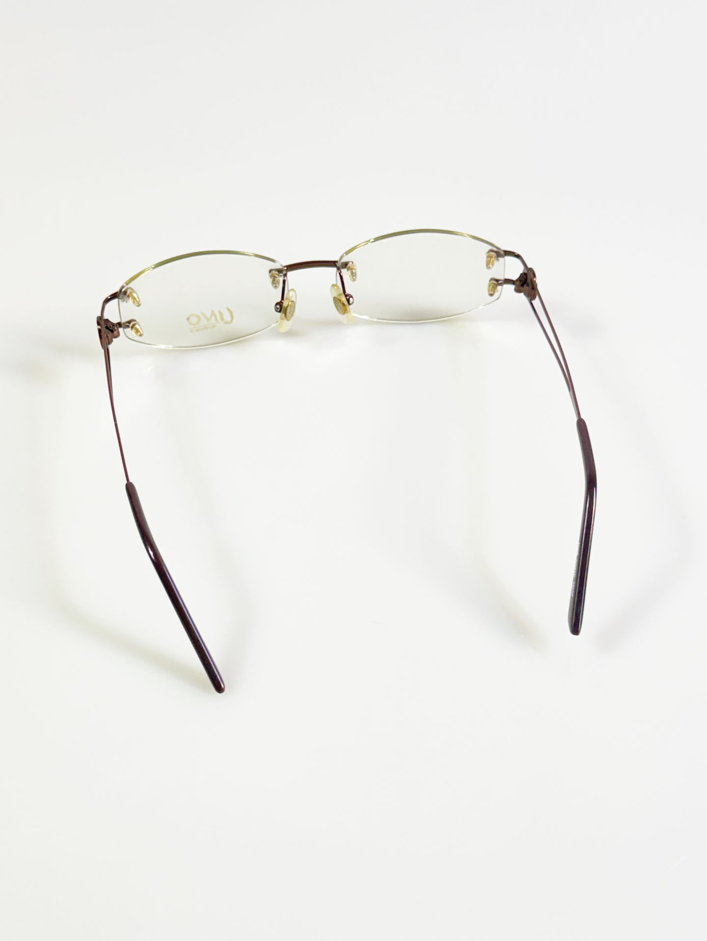 UNO Brown Rimless Oval Metal Glasses