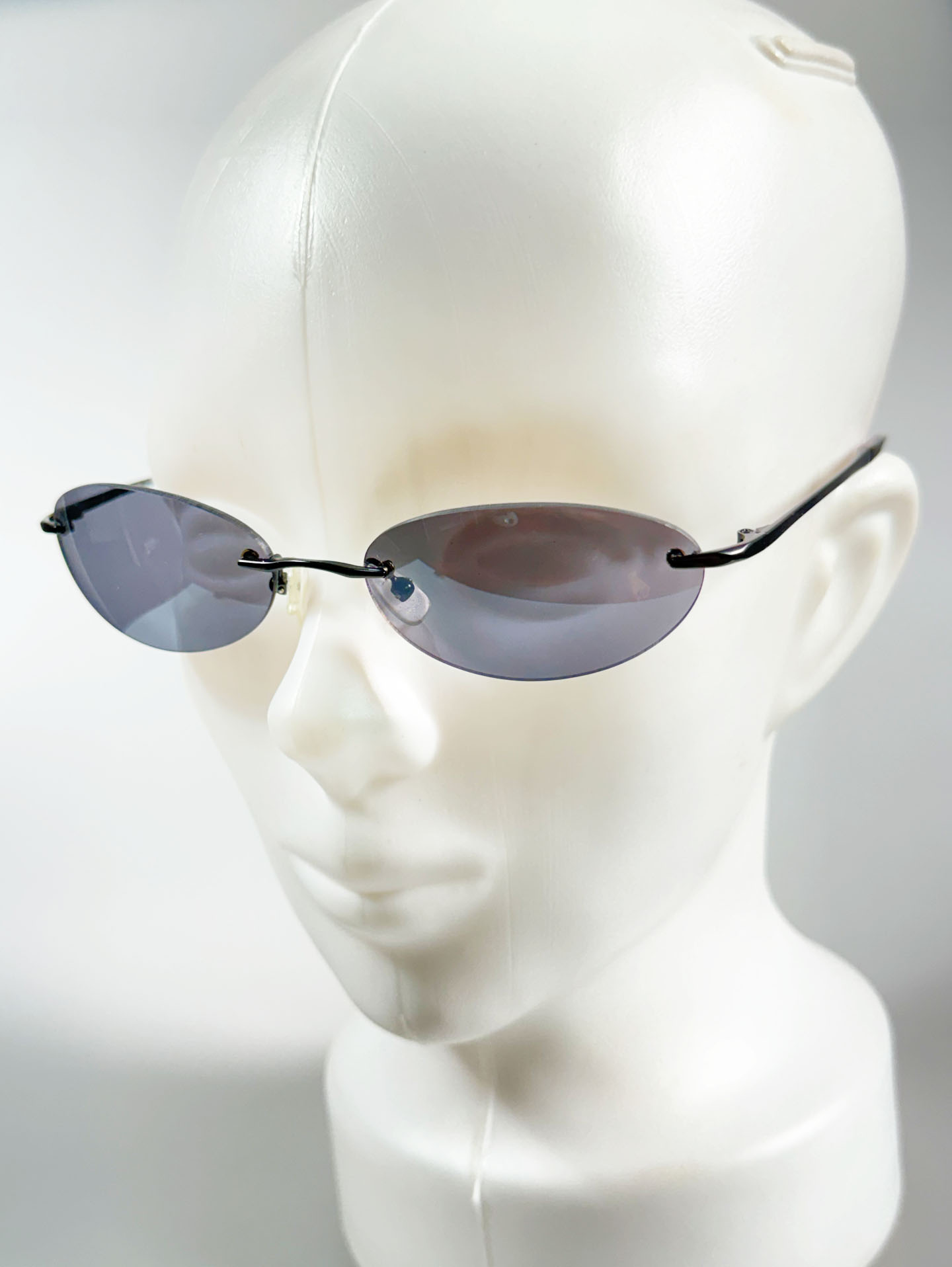 SILVIO VALENCIA Smoke Oval Rimless Metal Sunglasses