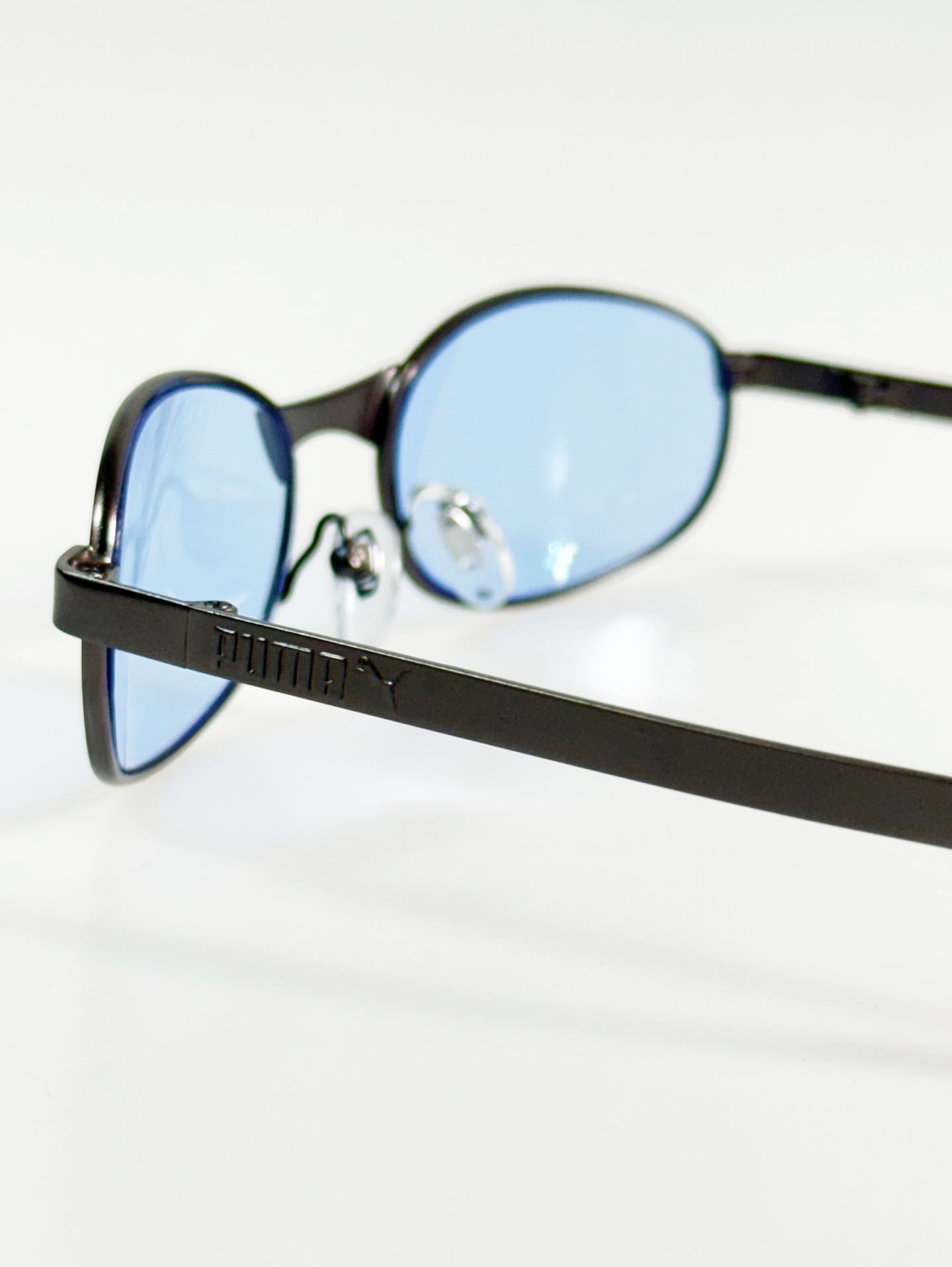 90's PUMA Dark Gunmetal Slim Oval Tint Sunglasses