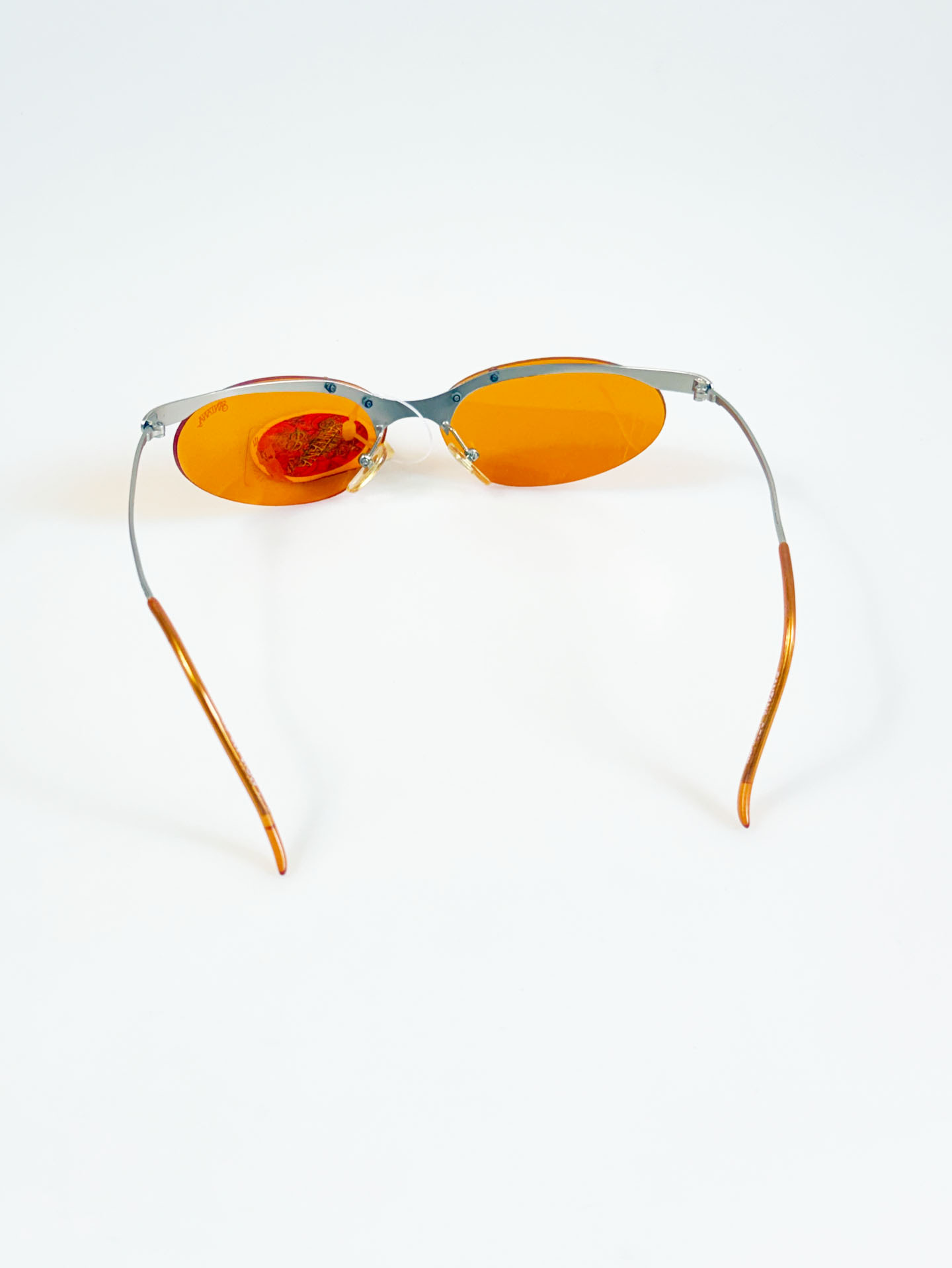 90's SANTANA Silver Rimless Oval Metal Orange Tint Sunglasses
