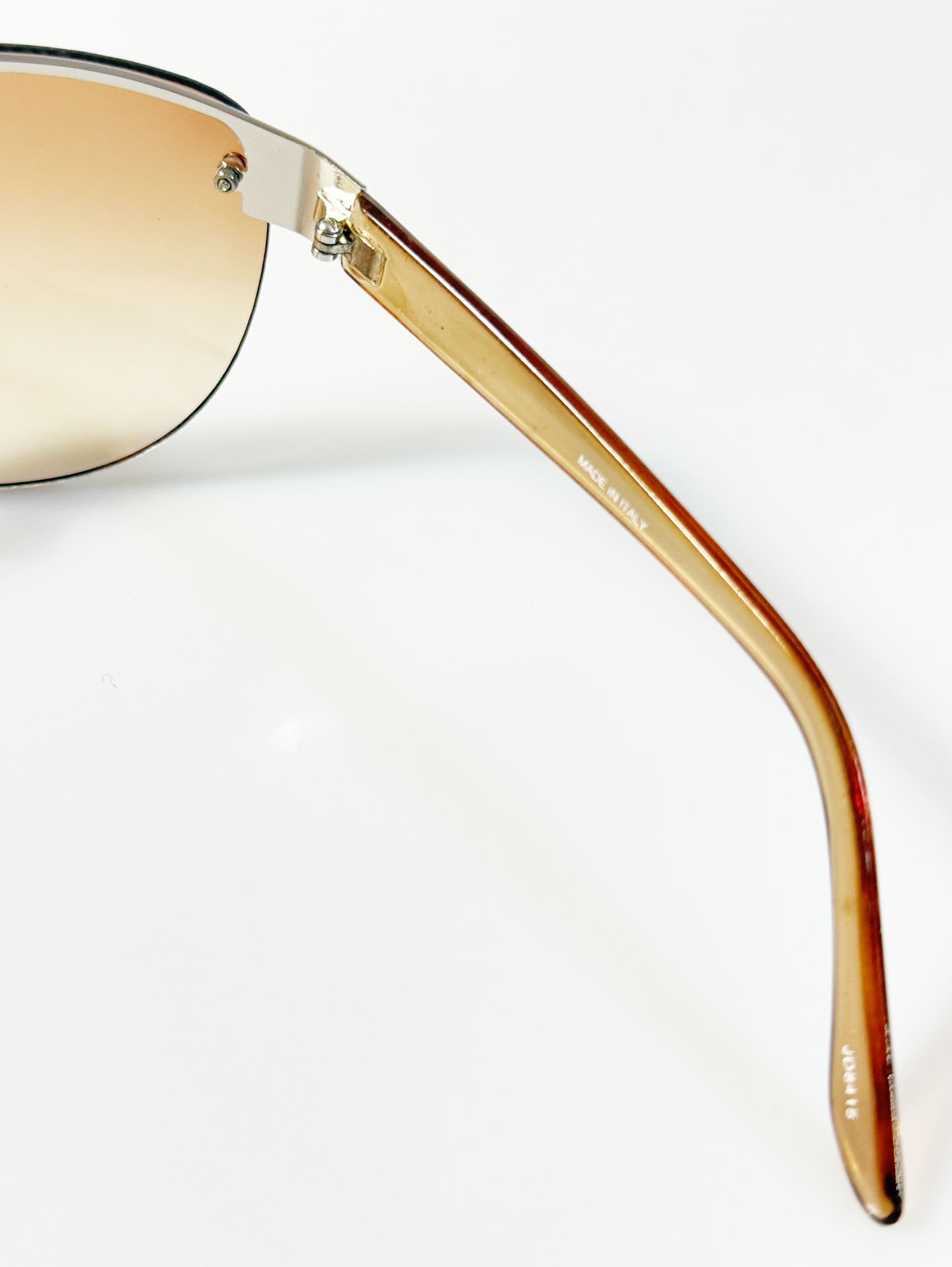 Wraparound Shield Rimless Metal Frame Tinted Sunglasses