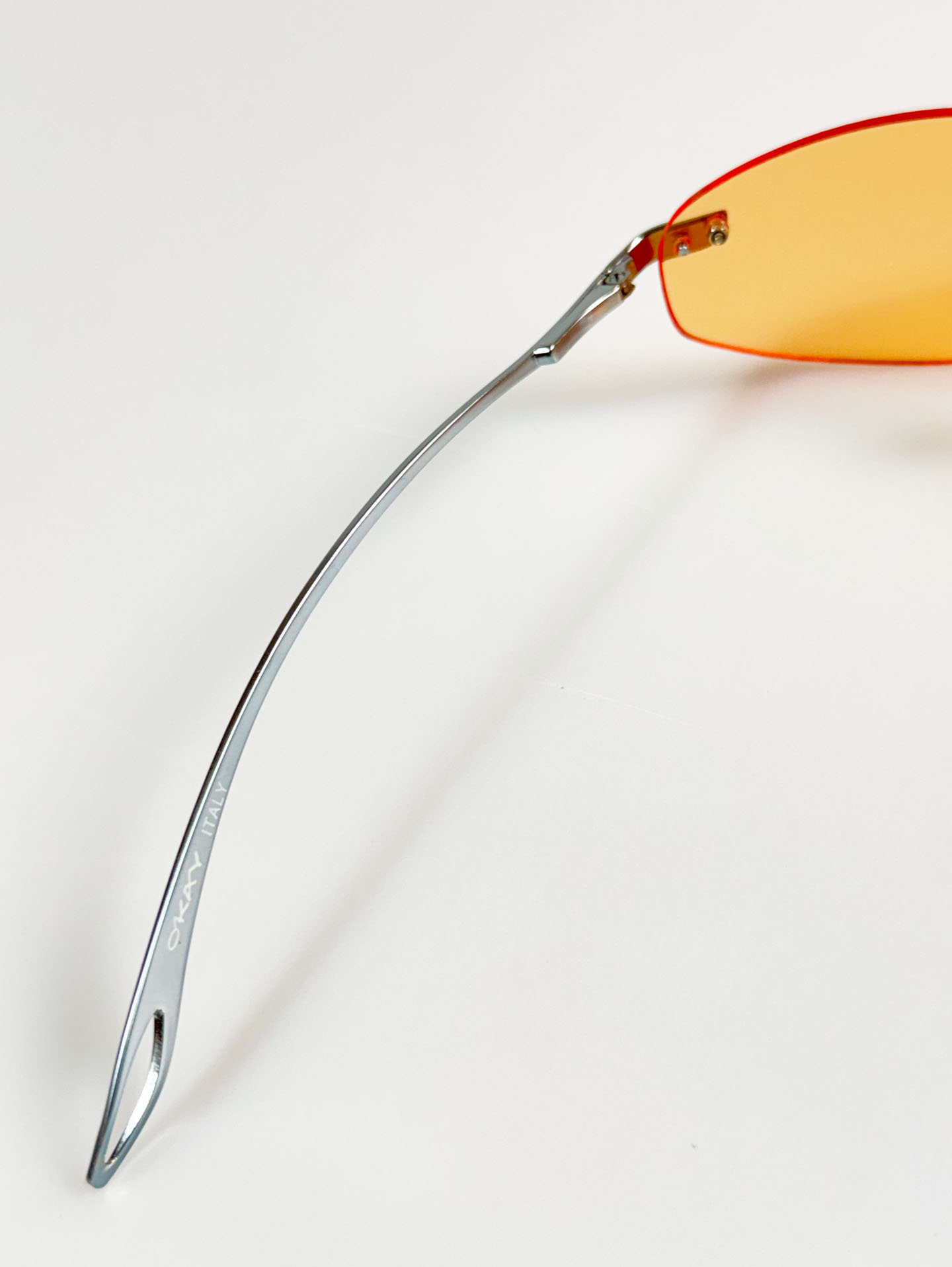 90's OKAY EYEWEAR Orange Tint Oval Rimless Metal Sunglasses